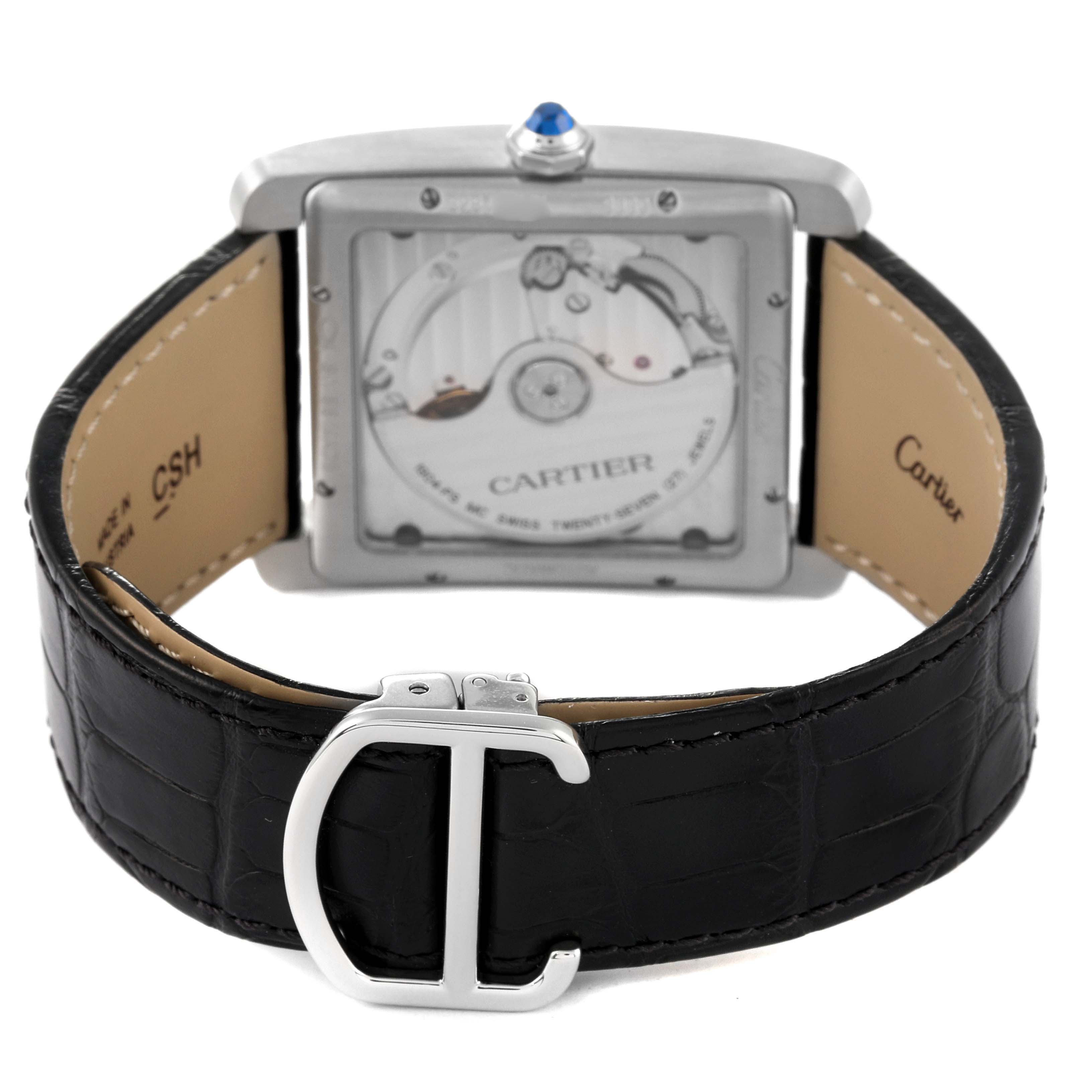 This image shows the back view of the Cartier Tank MC WSTA0010 Men's Stainless Steel Blue Dial WSTA0010 Men's Stainless Steel Blue Dial watch, highlighting its movement and leather strap.