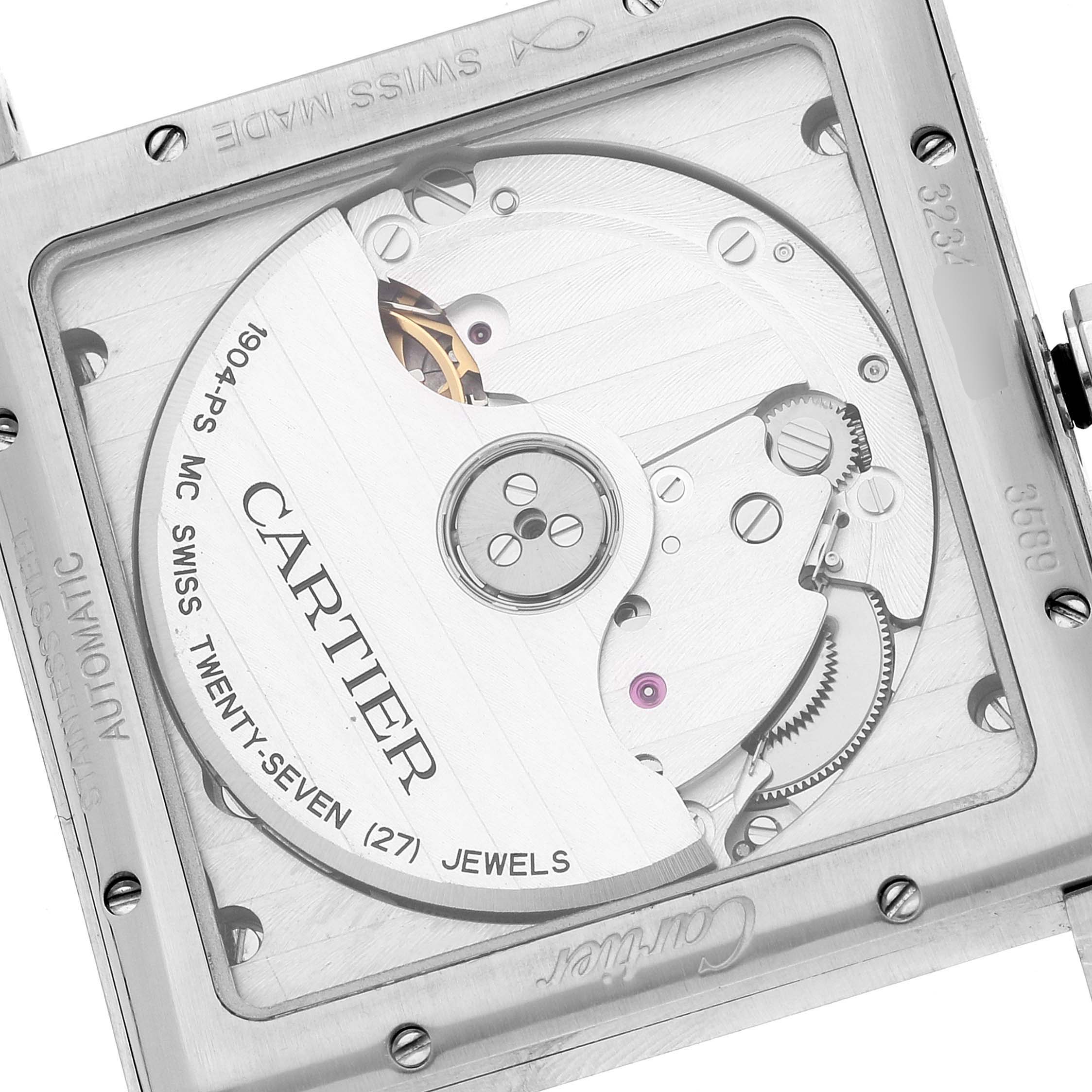 The image shows the back view of the Tank MC model by Cartier, highlighting the automatic movement and internal mechanism.