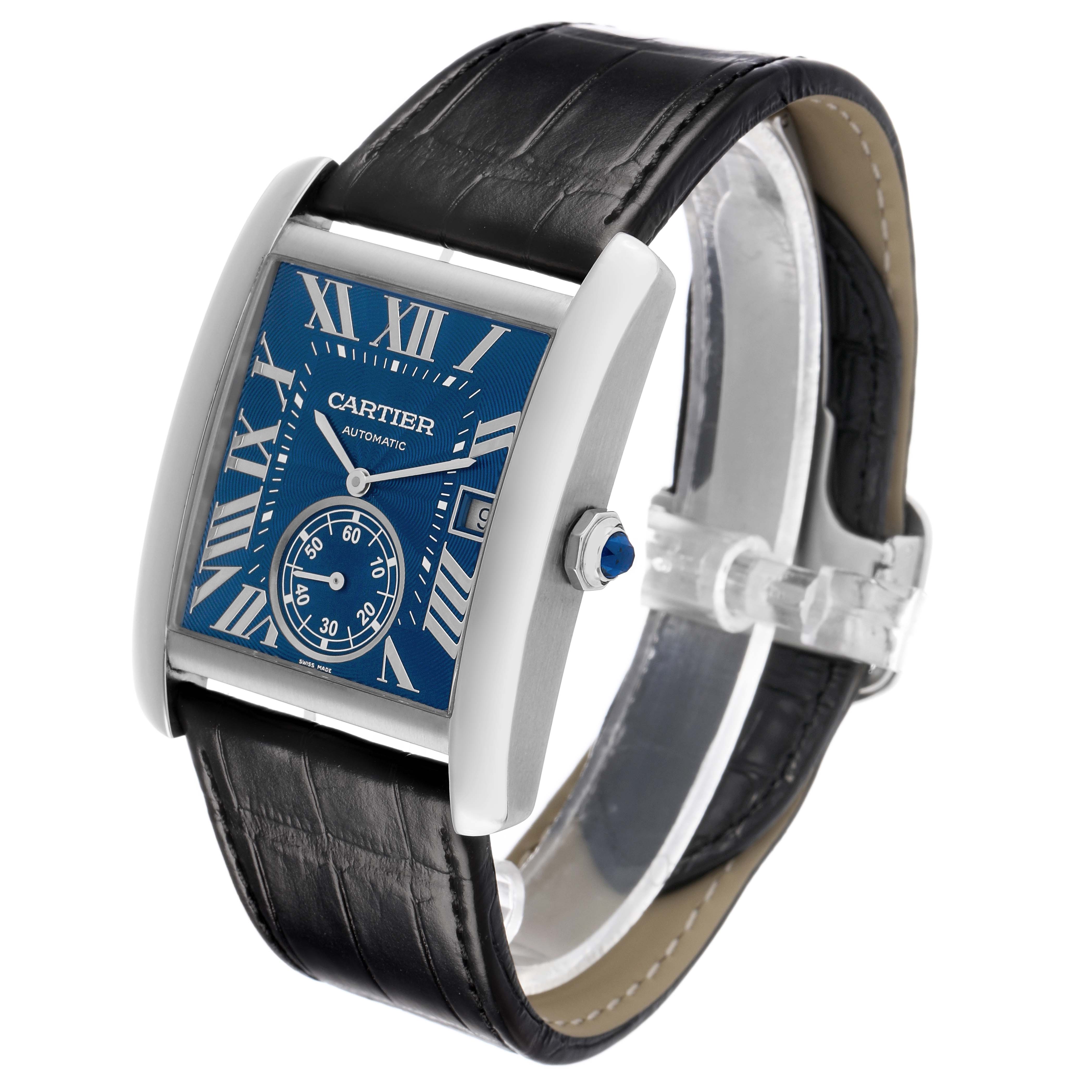 The Cartier Tank MC WSTA0010 Men's Stainless Steel Blue Dial watch is shown at a three-quarter angle, highlighting its face, case, crown, and leather strap.
