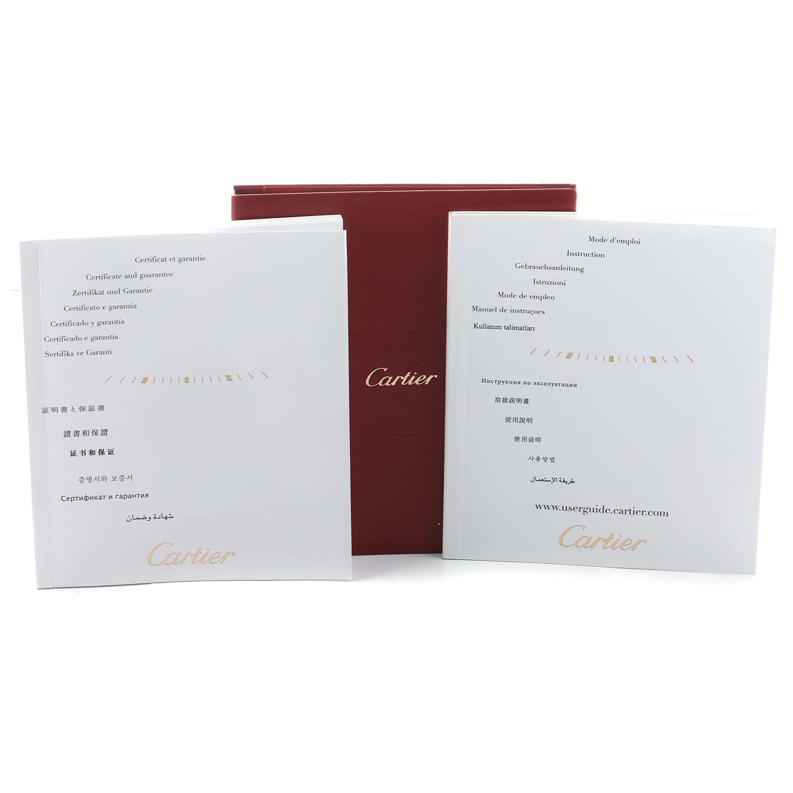 The image shows the documentation and packaging for a Cartier Tank MC WSTA0010 Men's Stainless Steel Blue Dial watch, including a red box and two manuals.