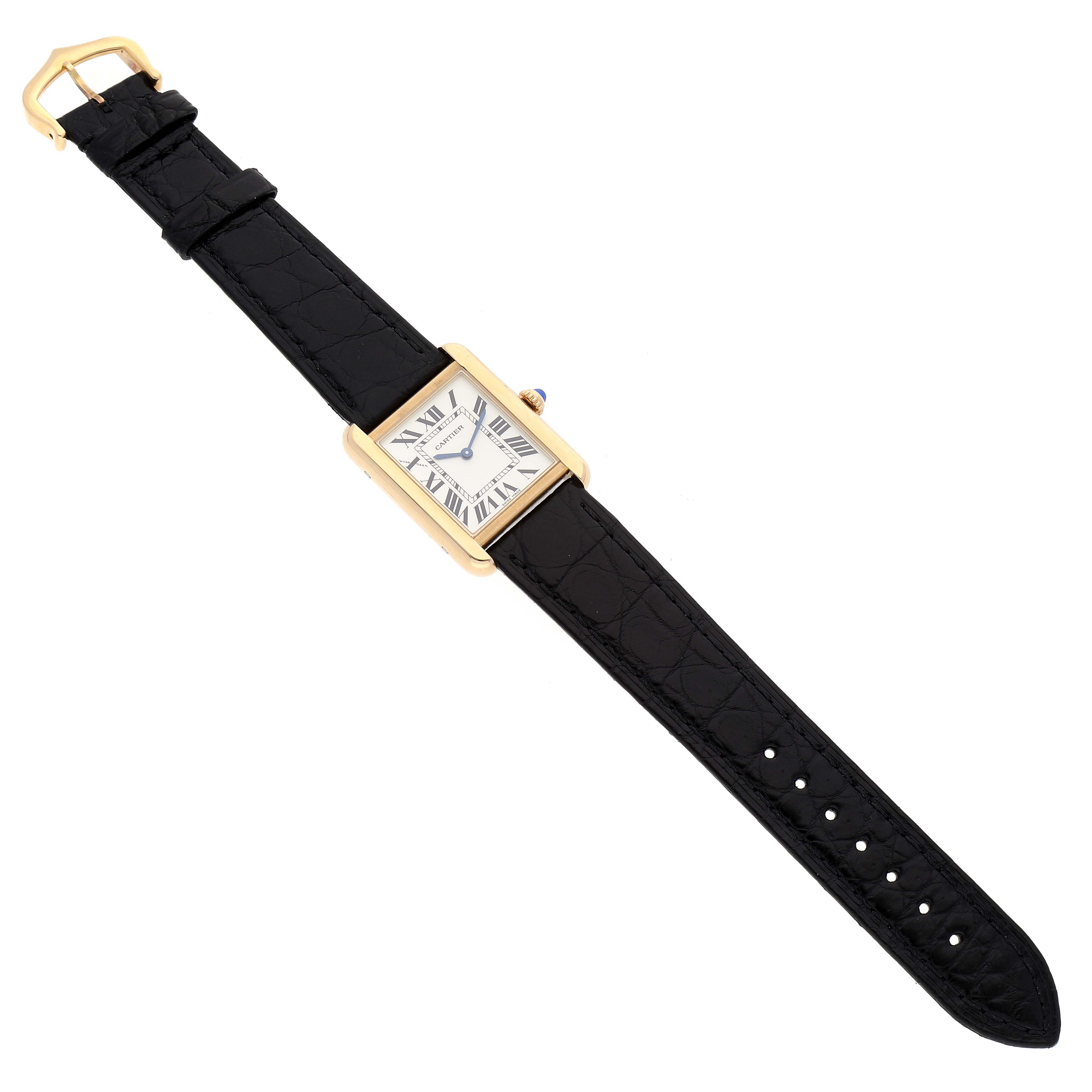 The Cartier Tank Solo W5200002 Women
s Yellow Gold Silver Dial W5200002 Women
s Yellow Gold Silver Dial watch is shown from a top-down angle, displaying the face, strap, and buckle.