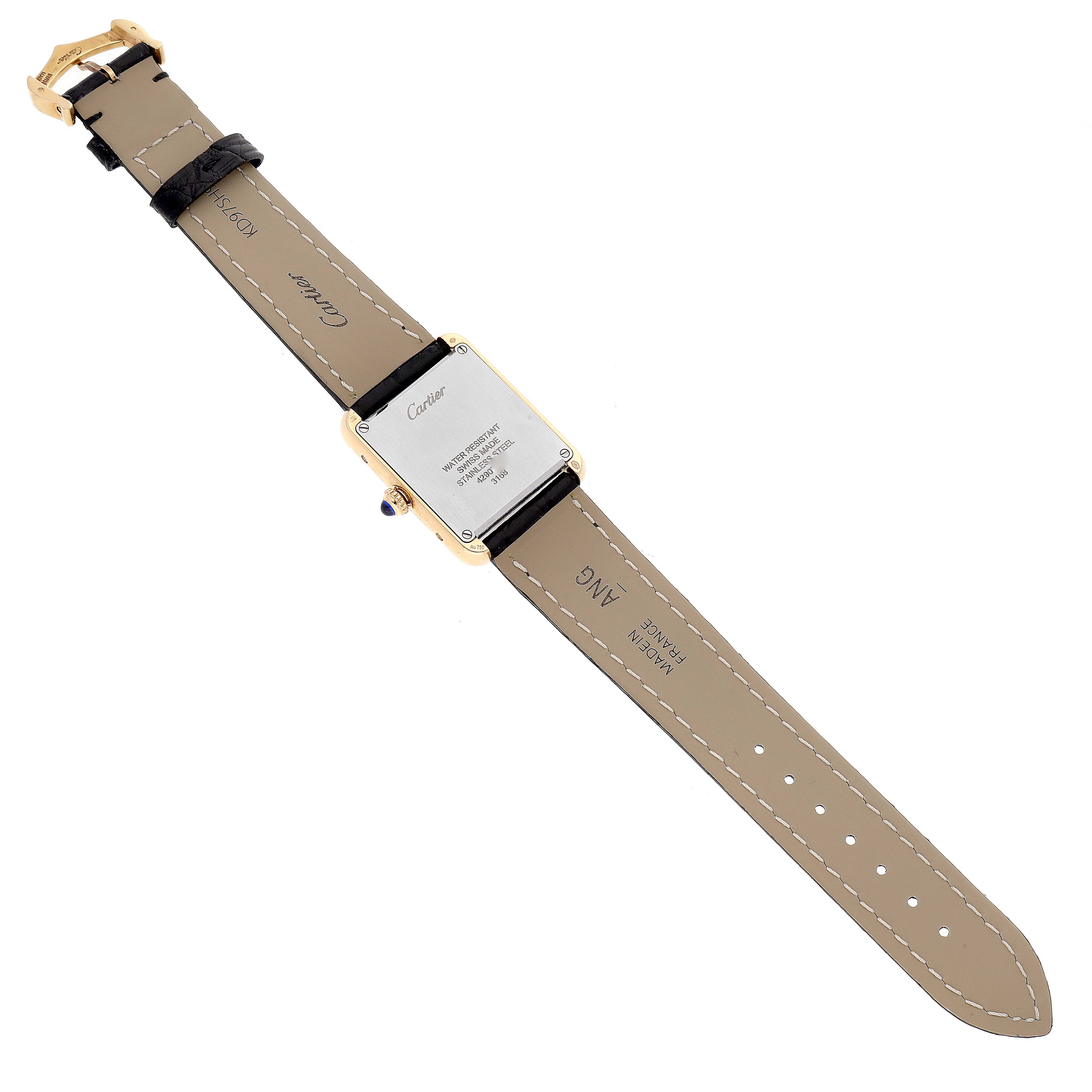 This image shows the backside of a Cartier Tank Solo W5200002 Women
s Yellow Gold Silver Dial W5200002 Women
s Yellow Gold Silver Dial watch, including the case back and leather strap.