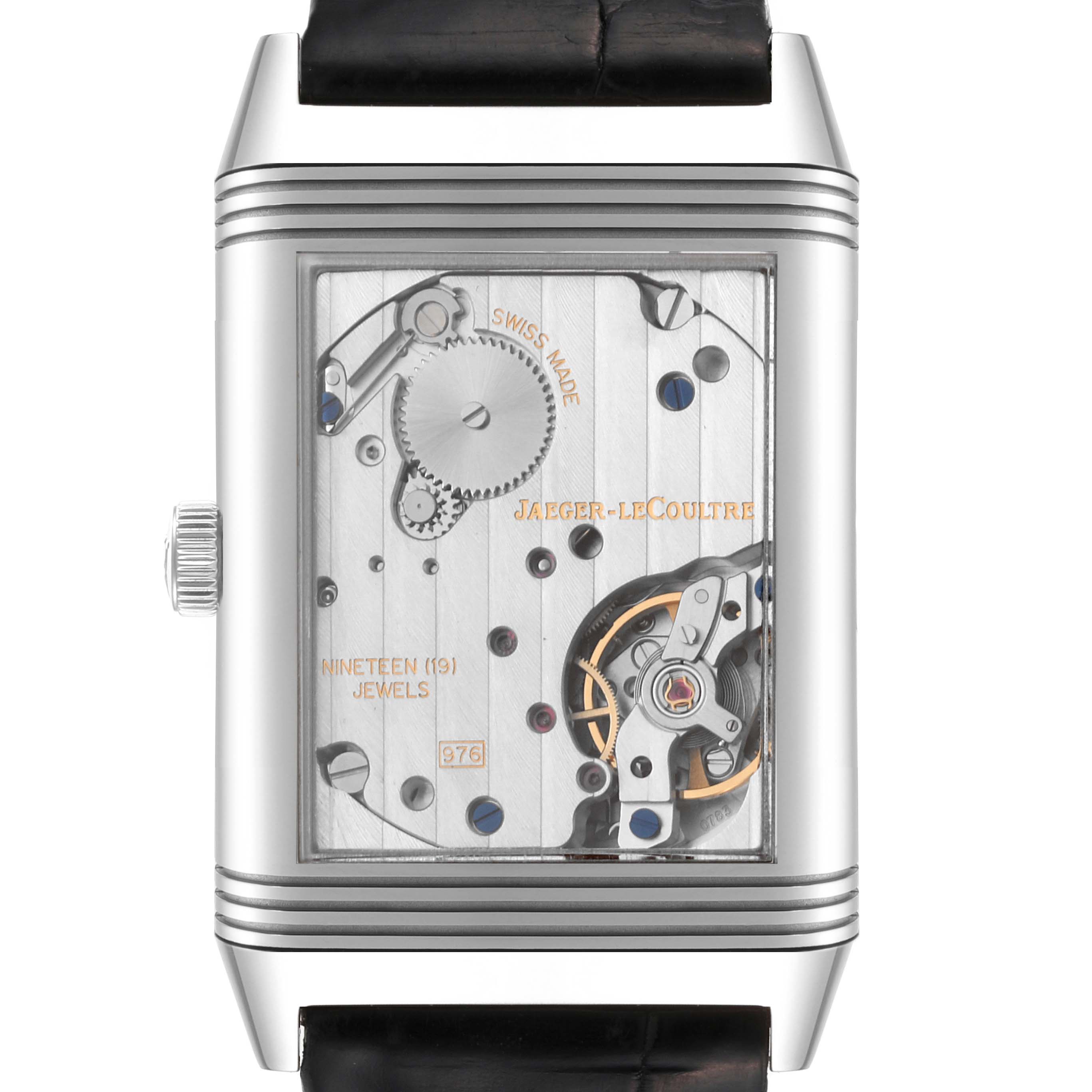 The image shows the back of a Jaeger-LeCoultre Reverso watch, highlighting its intricate inner mechanism and components.