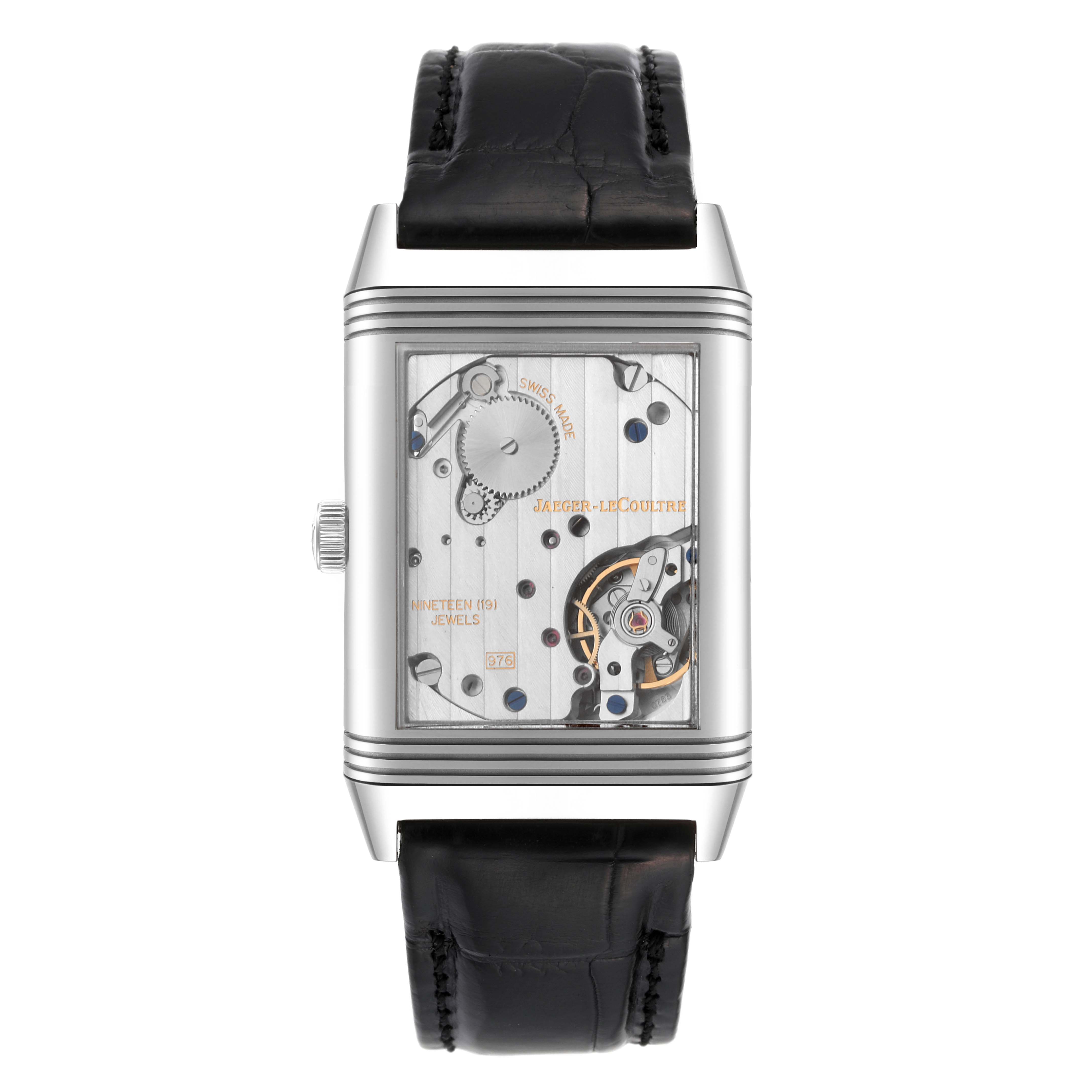 This image shows a Jaeger LeCoultre Reverso Q3738420 Men's Stainless Steel Silver Dial Q3738420 Men's Stainless Steel Silver Dial watch from a front angle, displaying its internal mechanism.