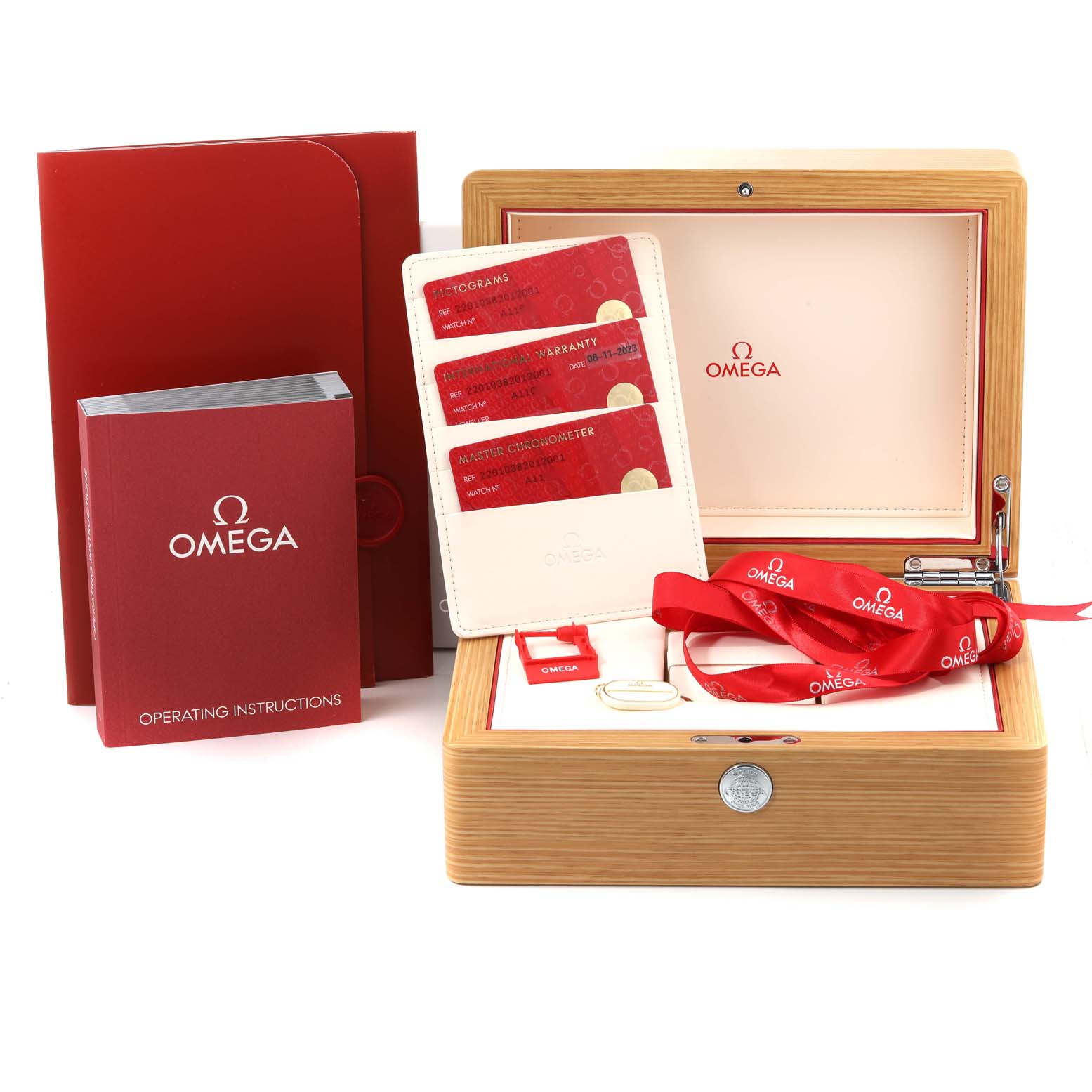 The image shows the packaging and accessories for an Omega Aqua Terra 220.10.38.20.12.001 Men's Stainless Steel Pink Dial 220.10.38.20.12.001 Men's Stainless Steel Pink Dial model watch, including a box, documentation, and red lanyards.