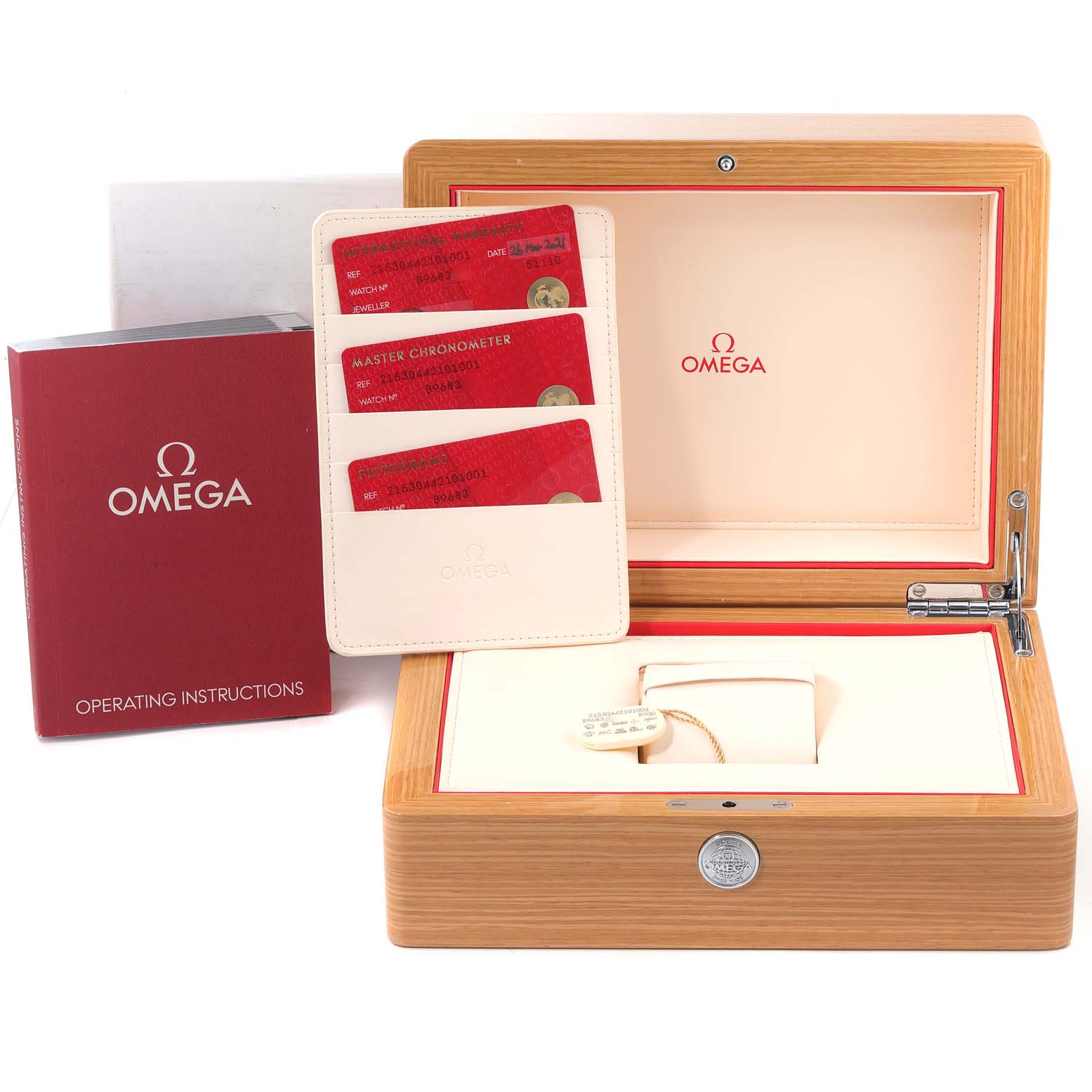 The image shows the packaging, operating instructions, and certificates for the Omega Planet Ocean 215.30.44.21.01.001 Men's Stainless Steel Black Dial 215.30.44.21.01.001 Men's Stainless Steel Black Dial model watch.