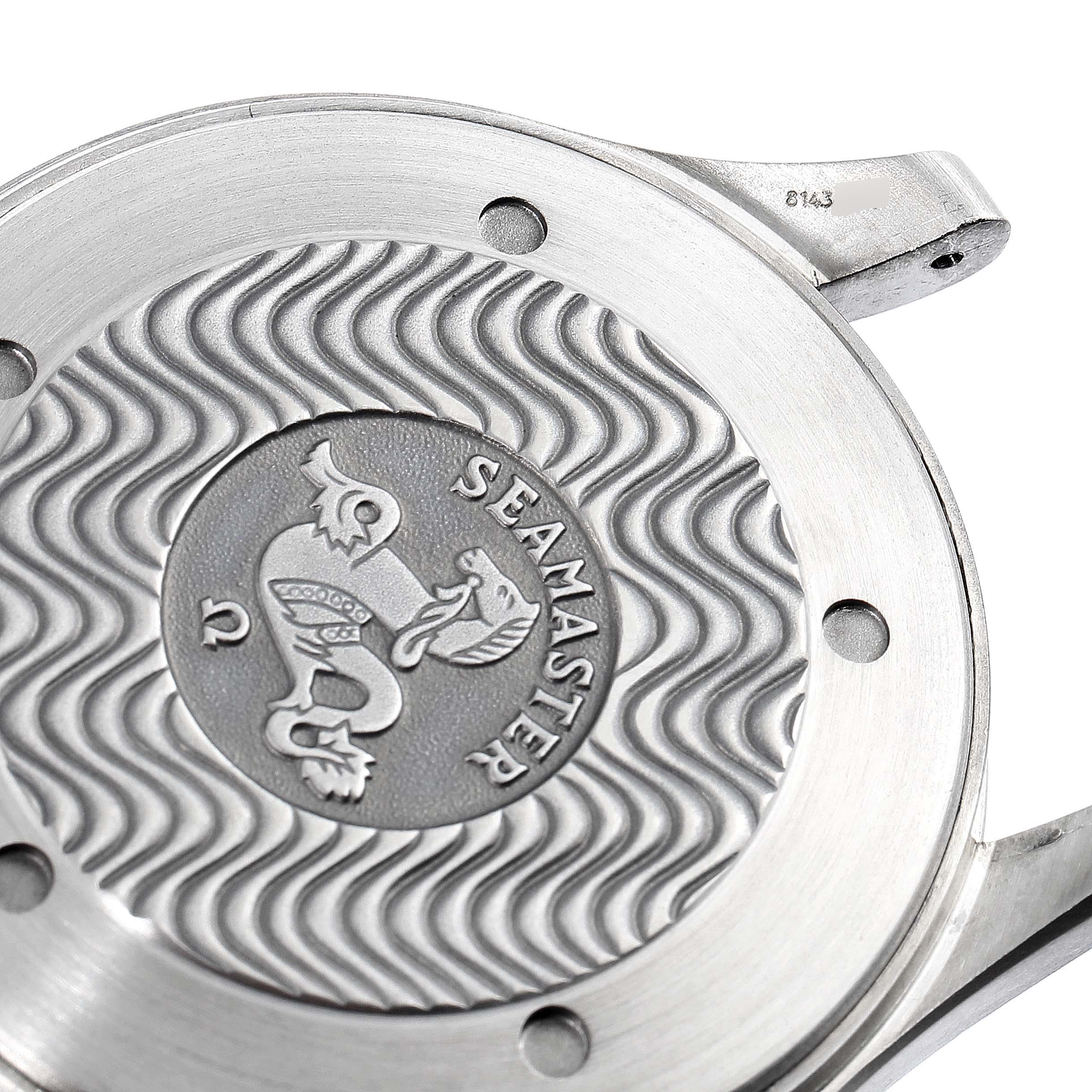 The image shows a close-up of the case back of an Omega Seamaster 2232.80.00 Men's Titanium Blue Dial 2232.80.00 Men's Titanium Blue Dial watch, highlighting its wave pattern and engraved logo.