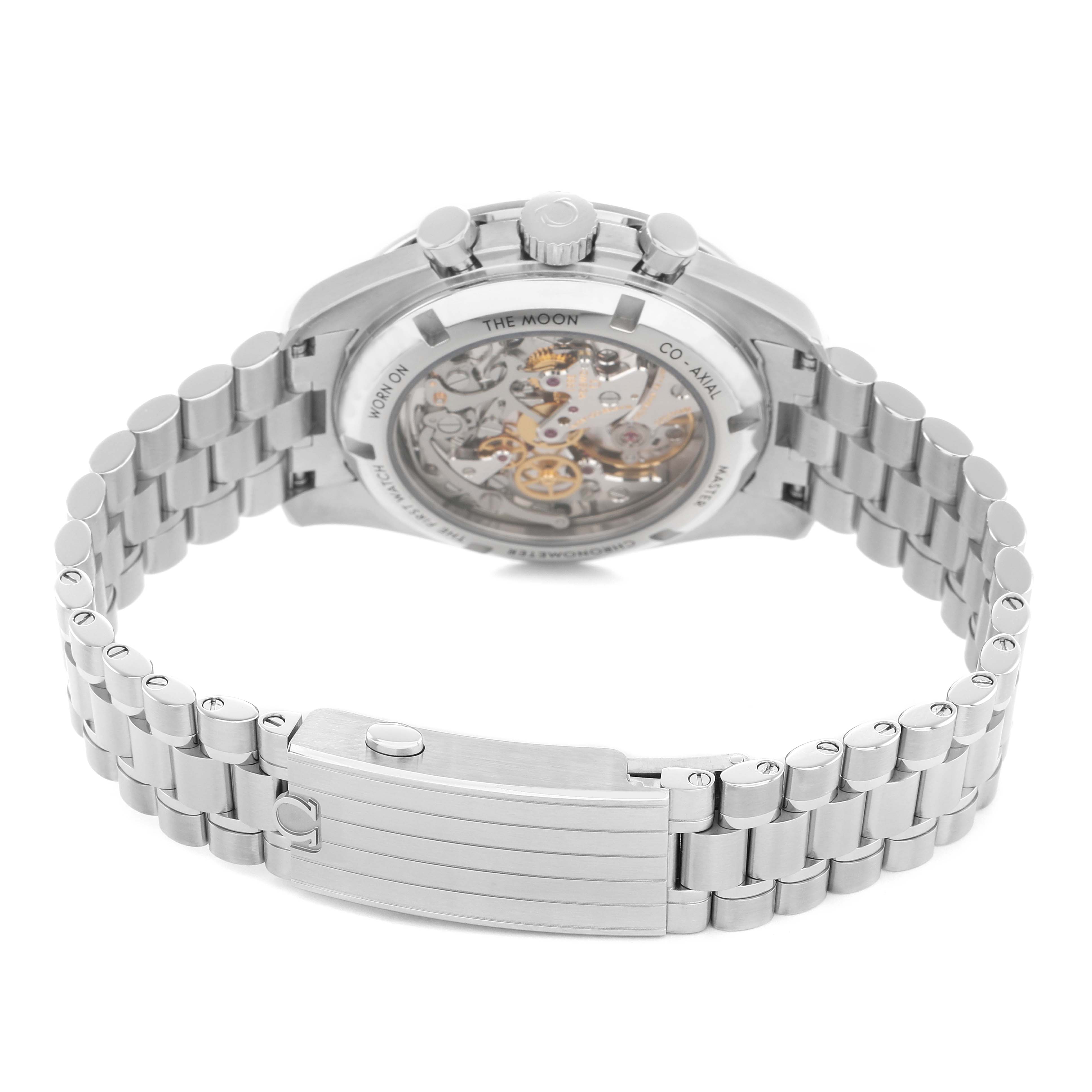 The Omega Speedmaster 310.30.42.50.04.001 Men's Stainless Steel White Dial watch is shown from the back, highlighting the exposed movement and the metal bracelet.