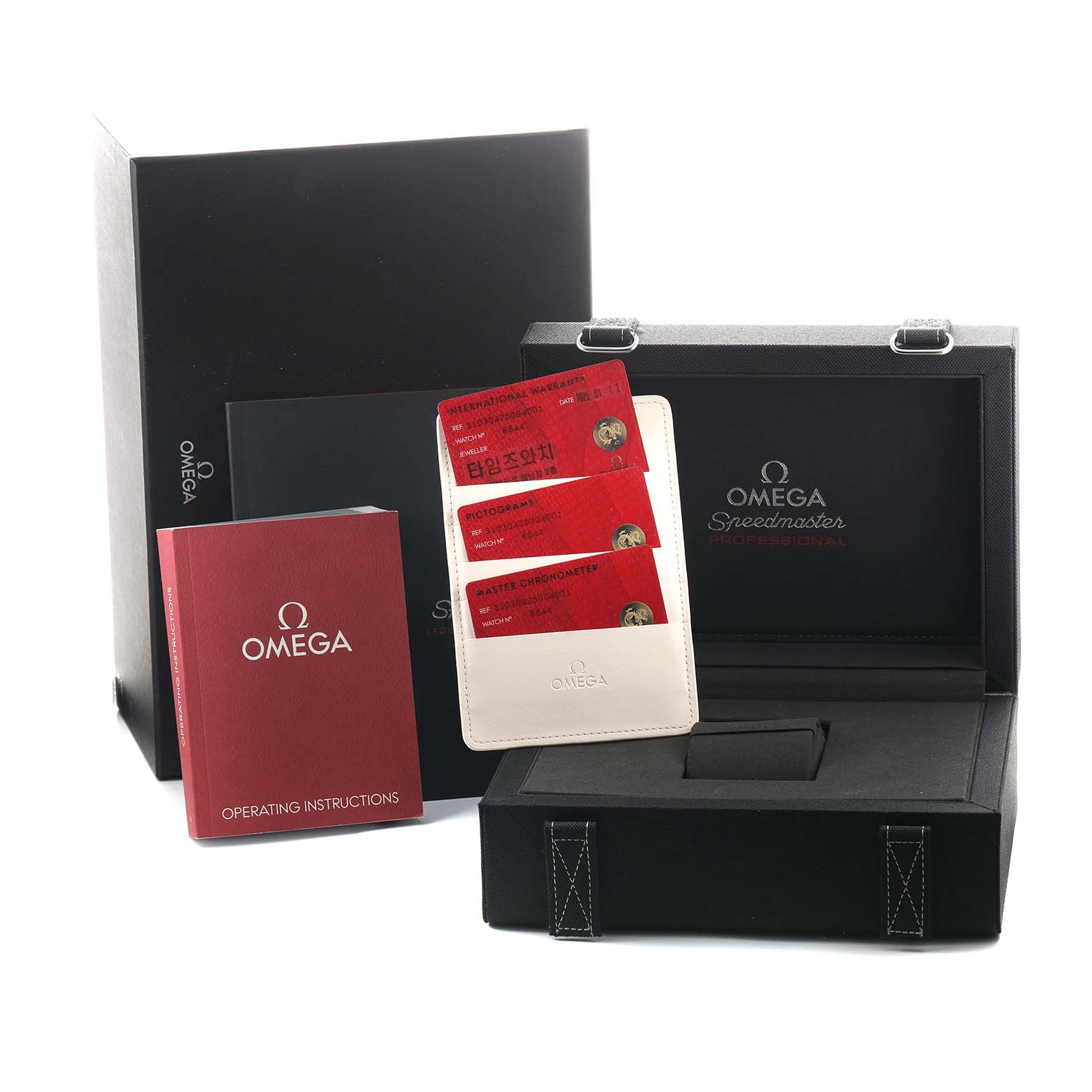 The image shows the Omega Speedmaster 310.30.42.50.04.001 Men's Stainless Steel White Dial packaging, instruction manual, and warranty cards from a front angle.