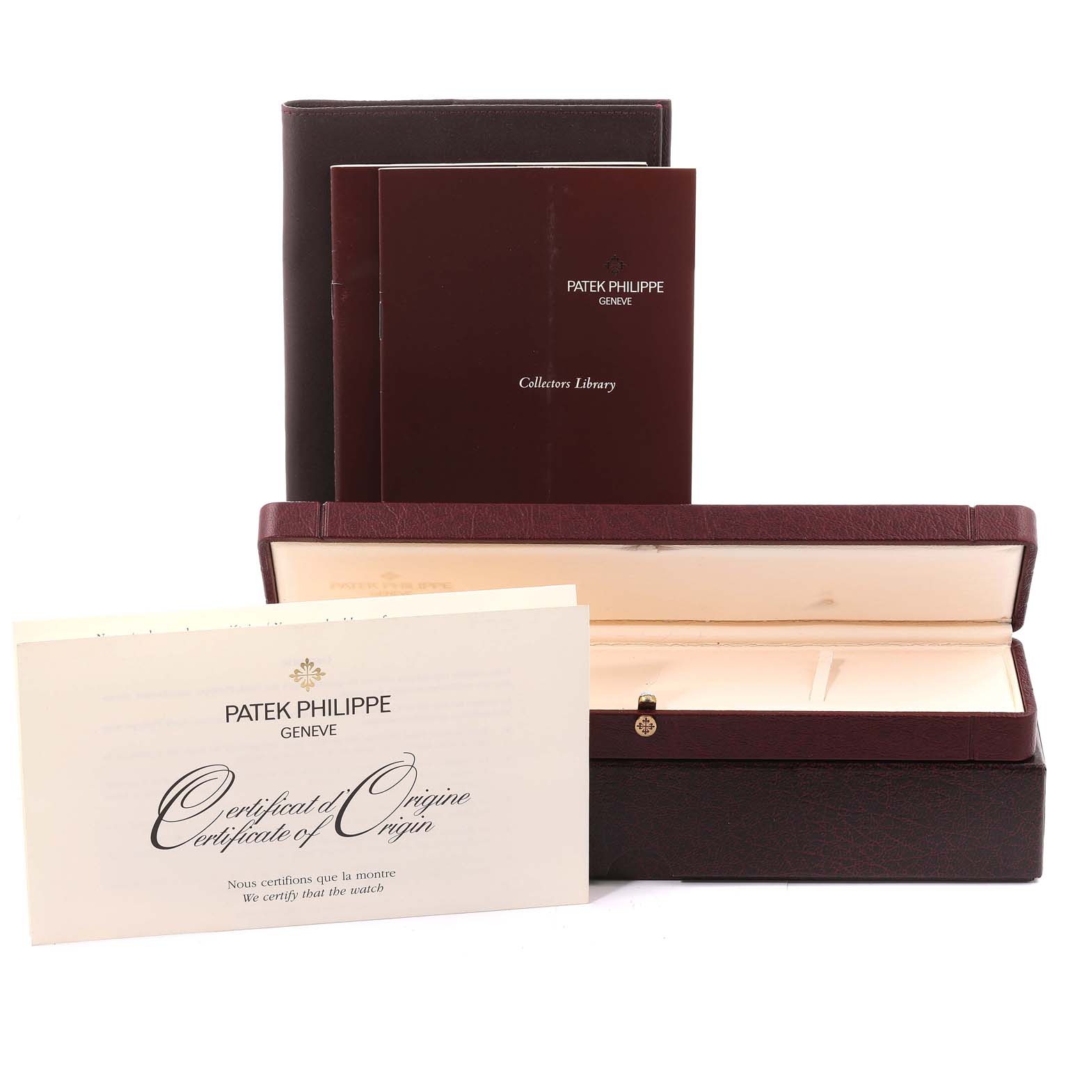 The image shows documentation and a storage box for the Patek Philippe Calatrava 5053 Men's White Gold Beige Dial 5053 Men's White Gold Beige Dial watch.