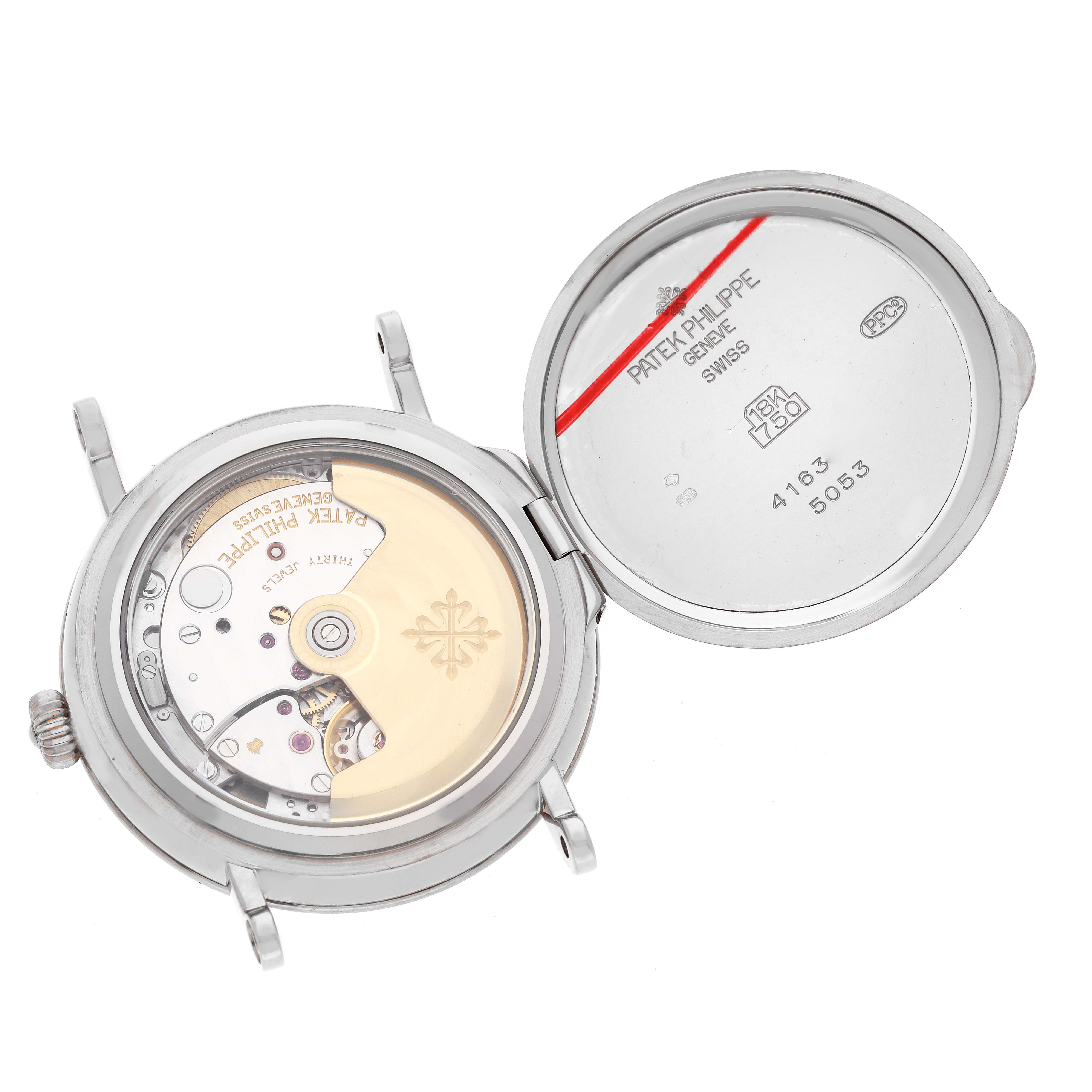 The image shows the open case back of a Patek Philippe Calatrava 5053 Men's White Gold Beige Dial 5053 Men's White Gold Beige Dial model, revealing the intricate movement inside.