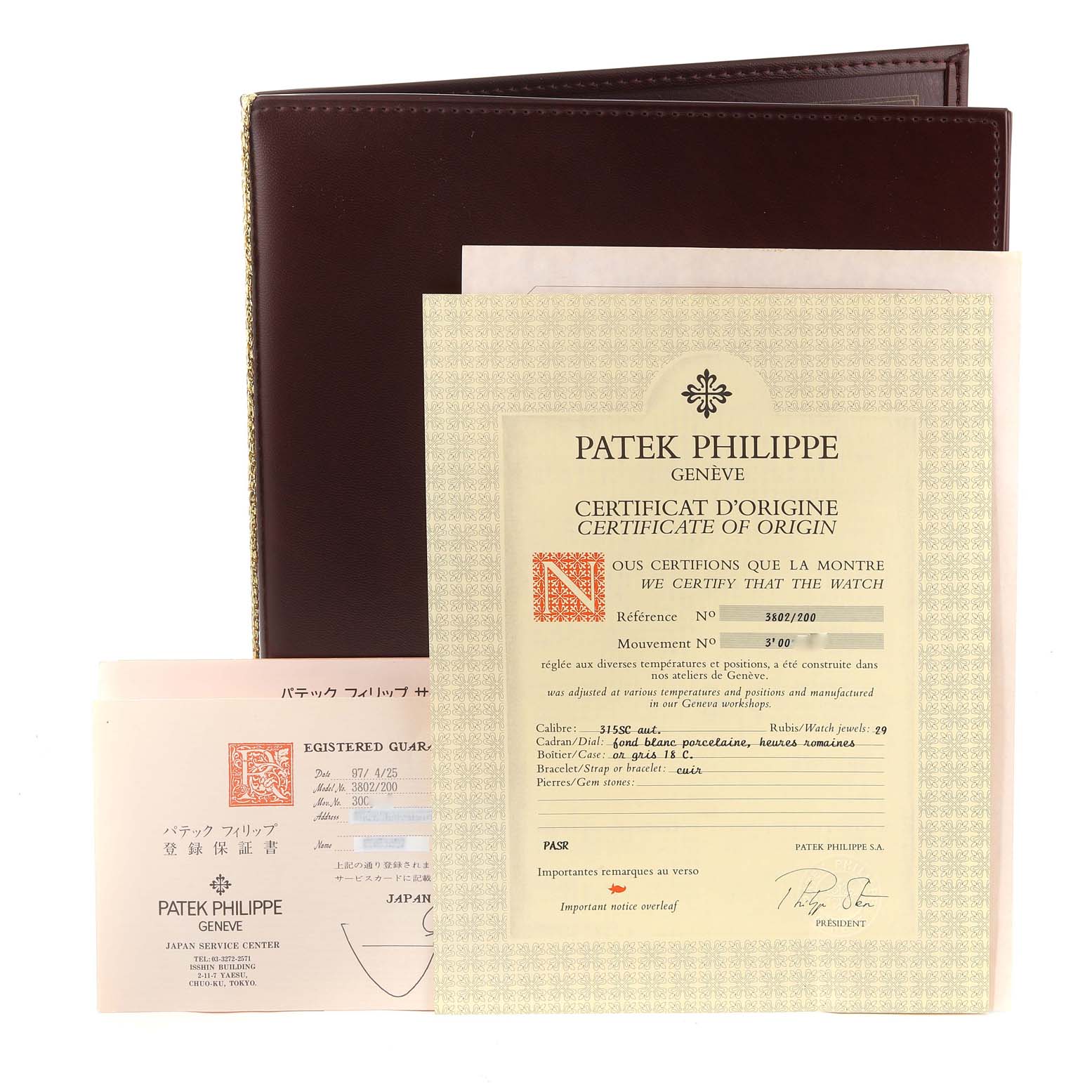The image shows the certificates and paperwork for a Patek Philippe Calatrava 3802/200 Men
s White Gold White Dial 3802/200 Men
s White Gold White Dial watch, including its Certificate of Origin.