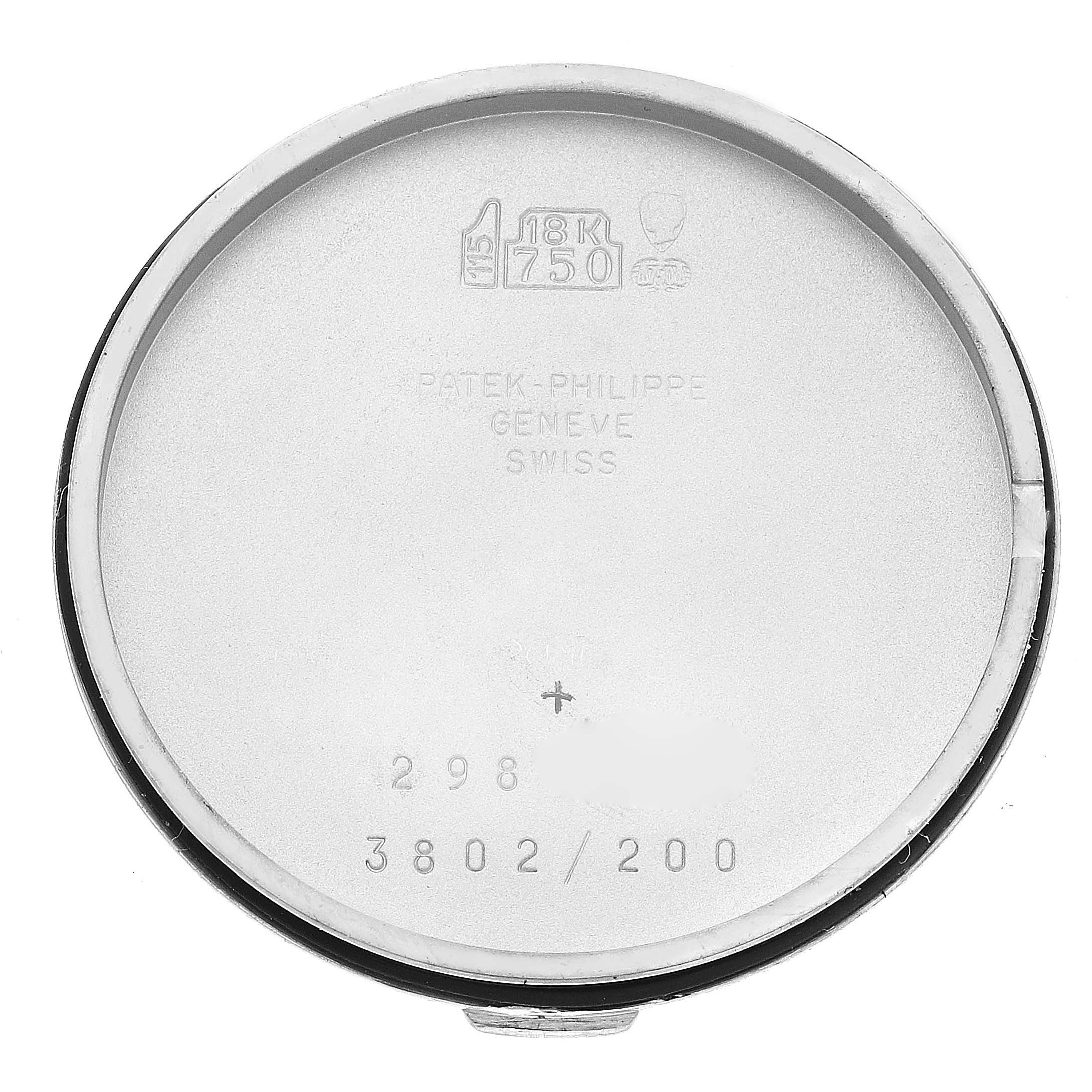 This image shows the inside case back of a Patek Philippe Calatrava 3802/200 Men
s White Gold White Dial 3802/200 Men
s White Gold White Dial model watch, featuring engravings and hallmarks.