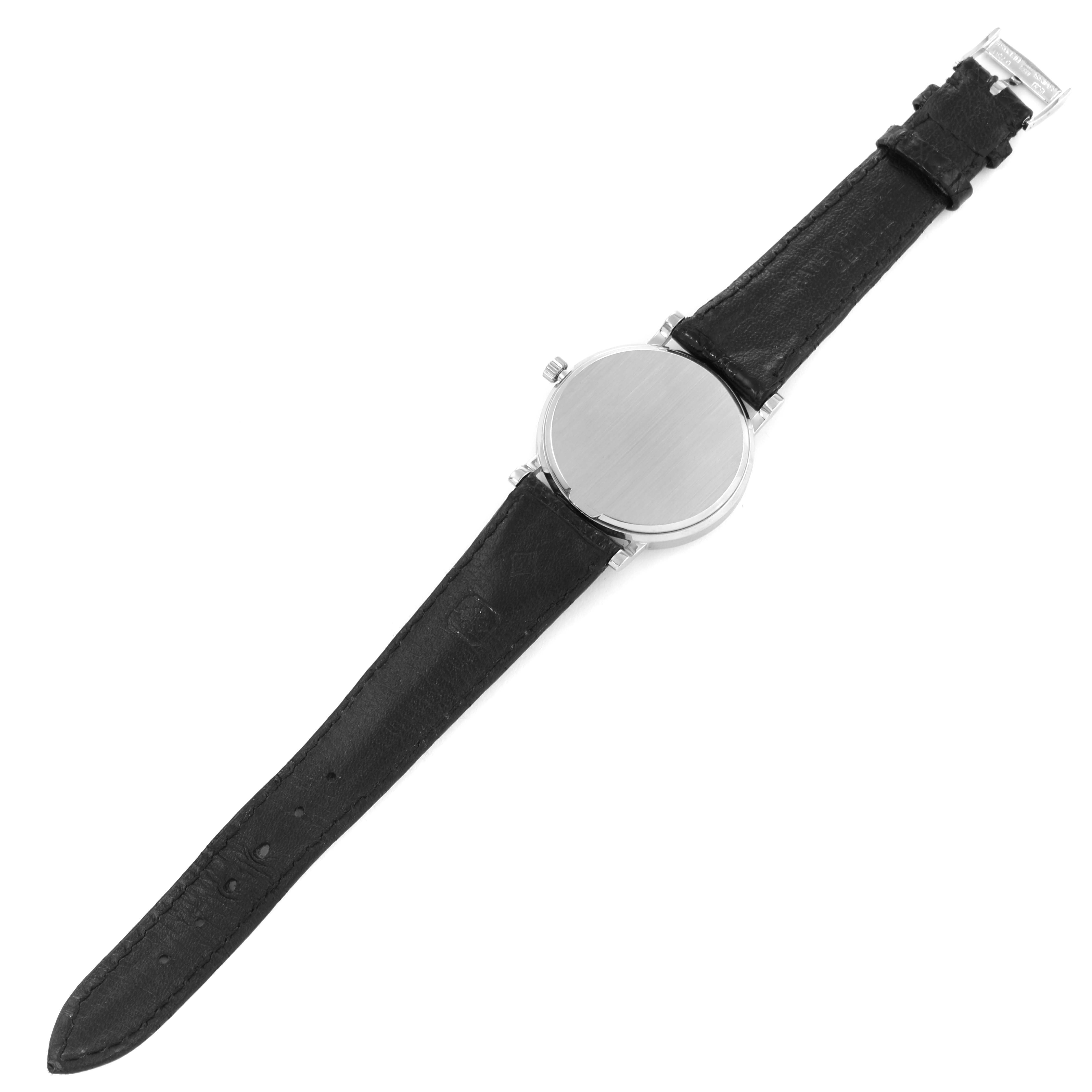 This image shows the back view of a Patek Philippe Calatrava 3802/200 Men
s White Gold White Dial 3802/200 Men
s White Gold White Dial model watch with a black leather strap.