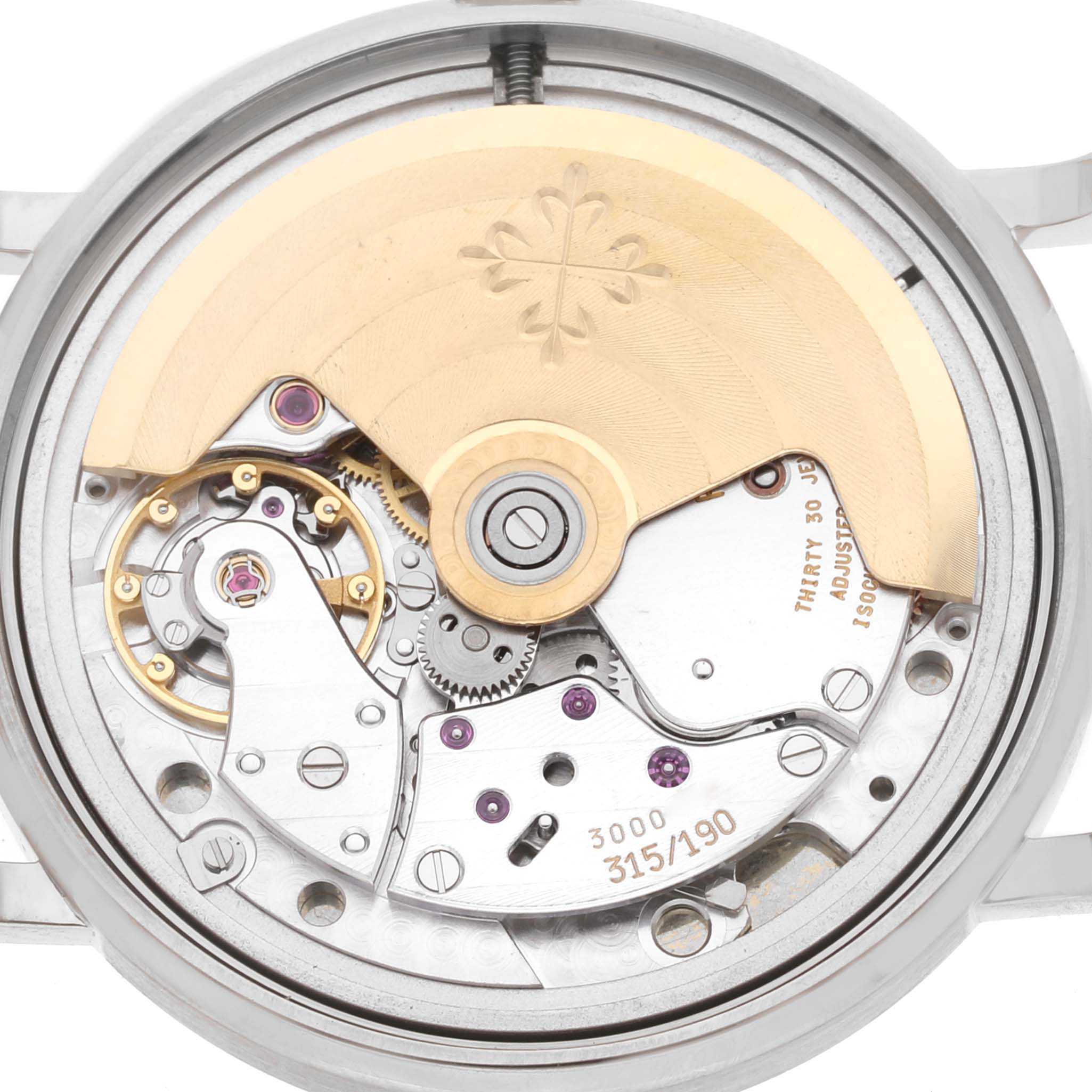 The image shows the back view of the Patek Philippe Calatrava 3802/200 Men
s White Gold White Dial 3802/200 Men
s White Gold White Dial watch, highlighting its intricate mechanical movement.