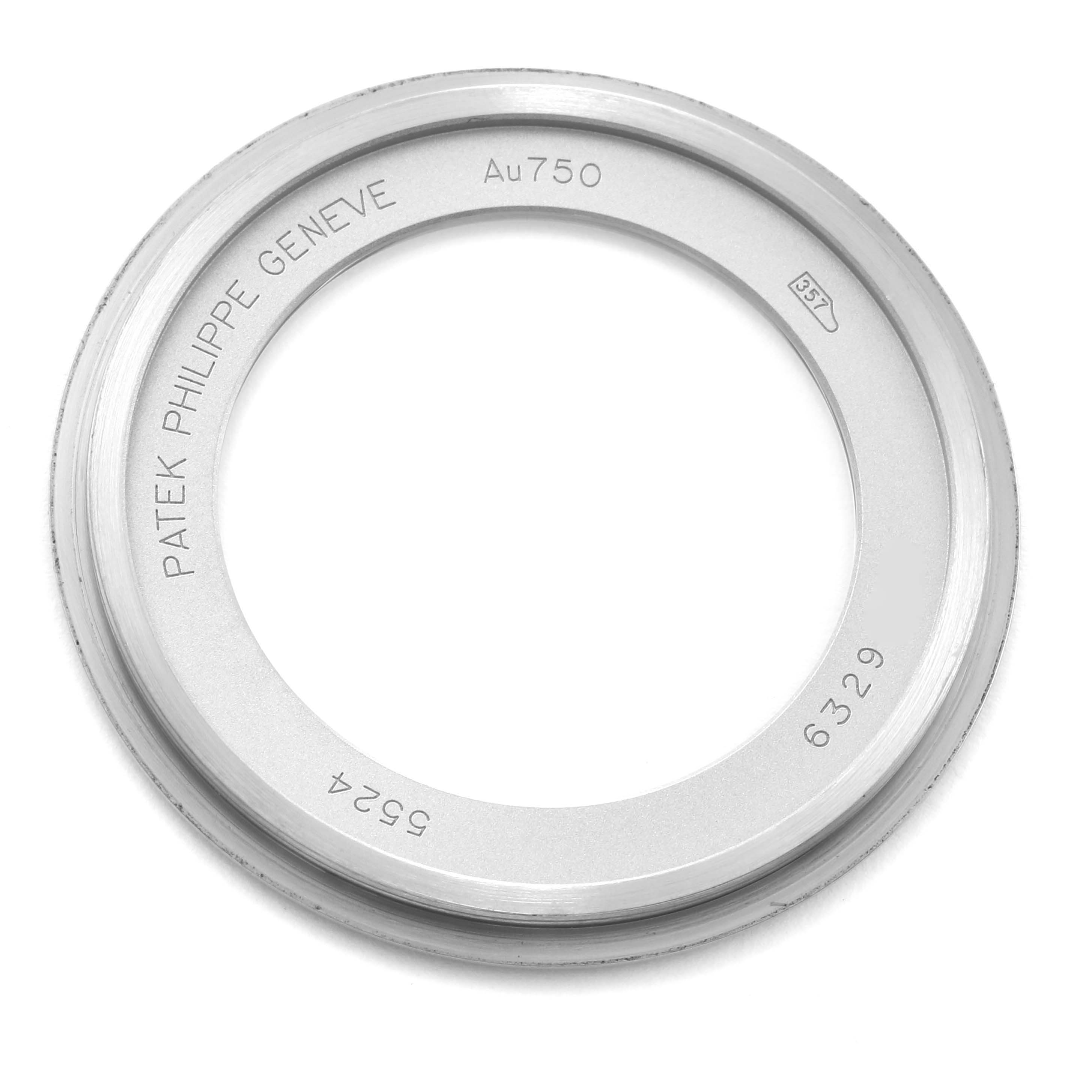 This image shows a top-down view of a bezel from a Patek Philippe Calatrava 5524G-001 Men's White Gold Black Dial 5524G-001 Men's White Gold Black Dial watch, displaying its engravings.