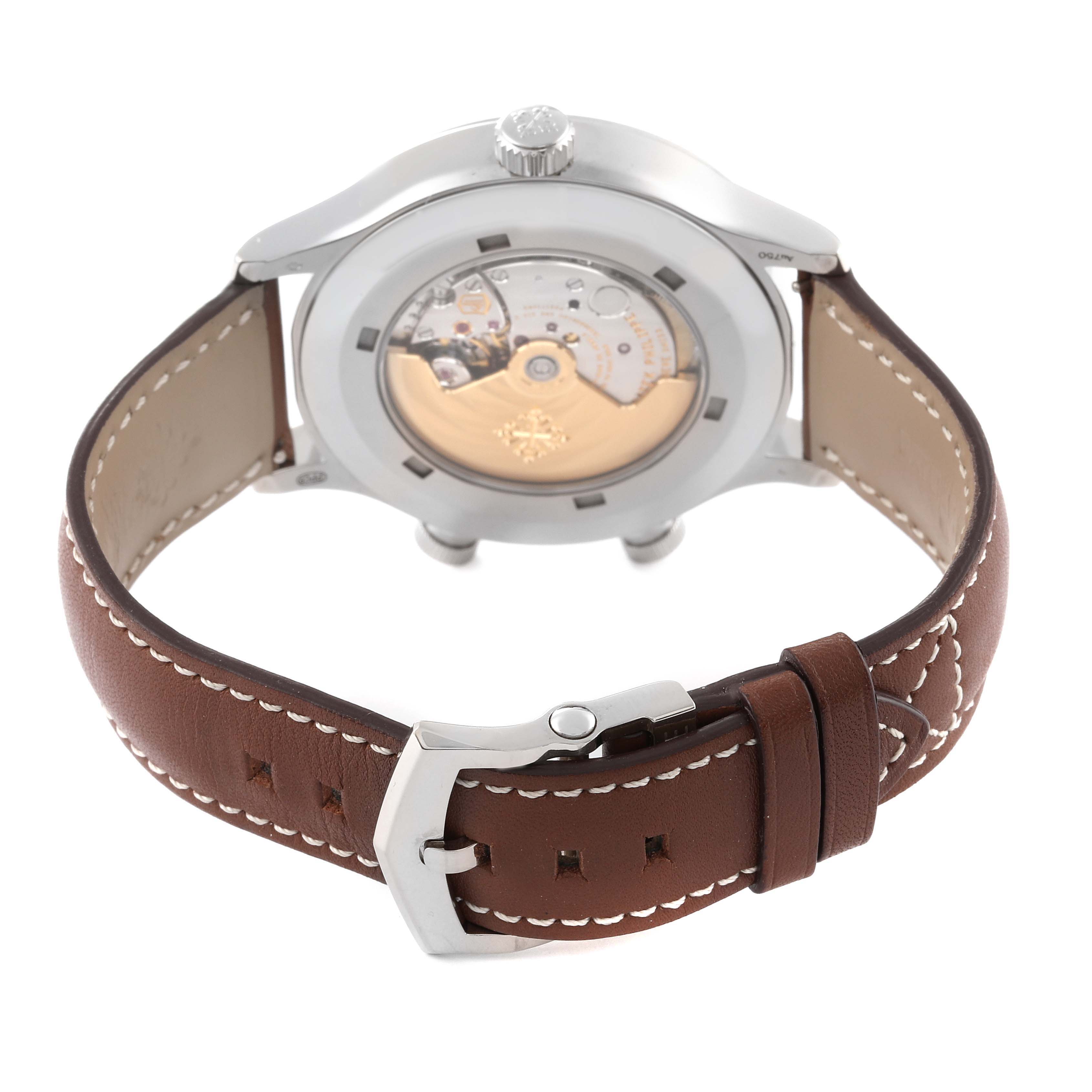 The image shows the back view of a Patek Philippe Calatrava 5524G-001 Men's White Gold Black Dial 5524G-001 Men's White Gold Black Dial watch, highlighting its leather strap and visible mechanical movement.