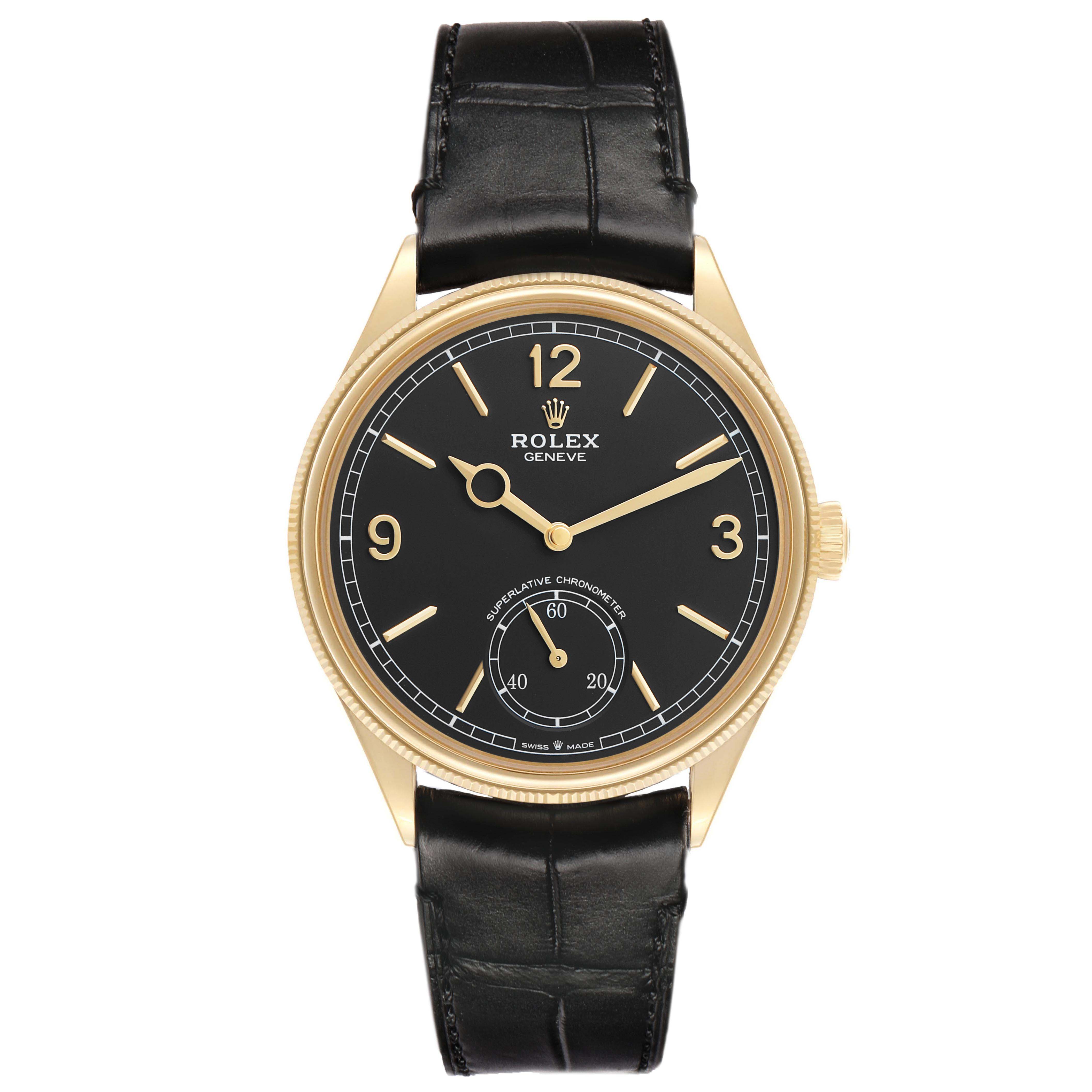 The Rolex 1908 52508 Men's Yellow Gold Black Dial model is shown from the front, displaying the face, hands, and leather strap.