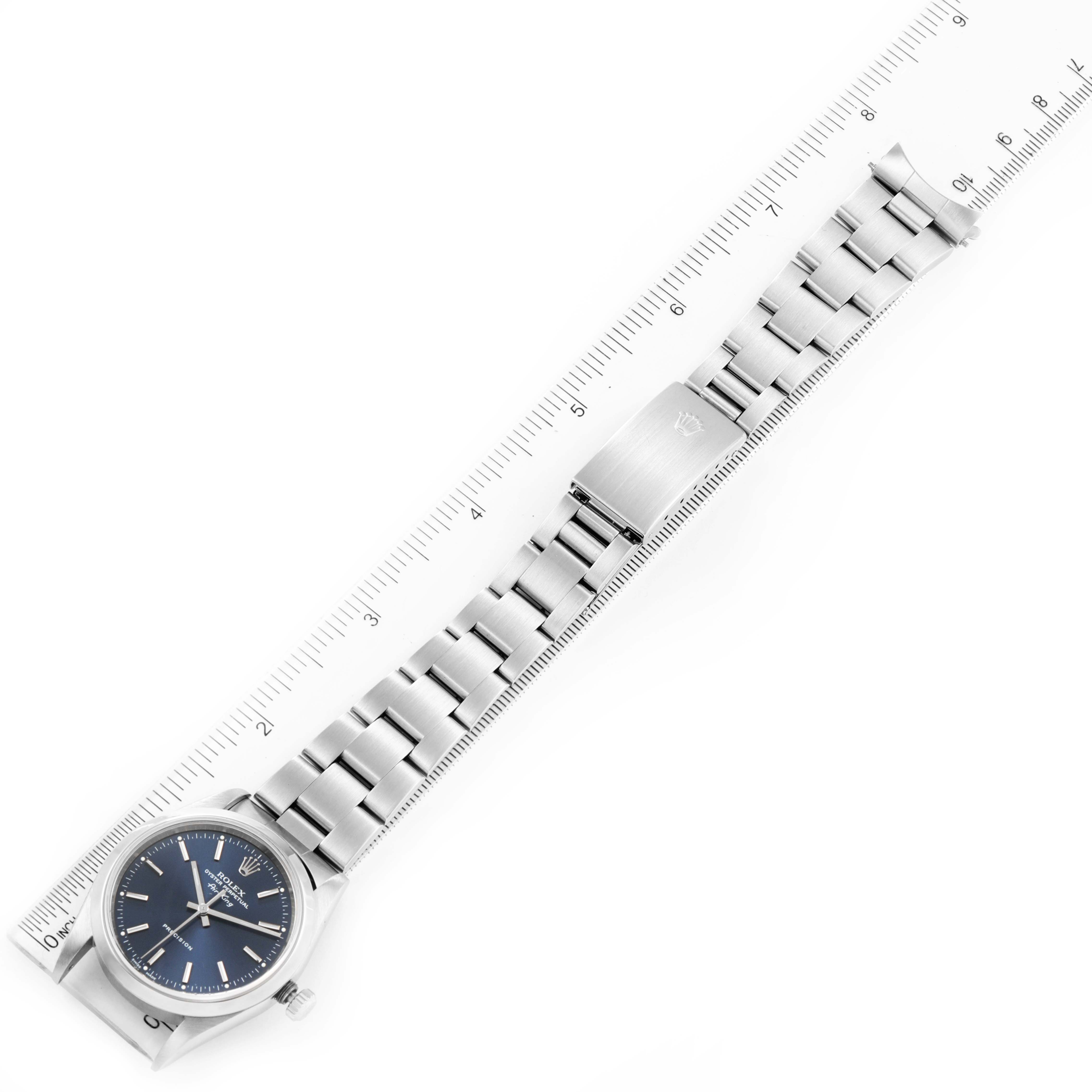 The image shows the Rolex Air-King 14000 Men's Stainless Steel Blue Dial 14000 Men's Stainless Steel Blue Dial watch laid flat alongside a ruler, displaying the full length of the band and face.