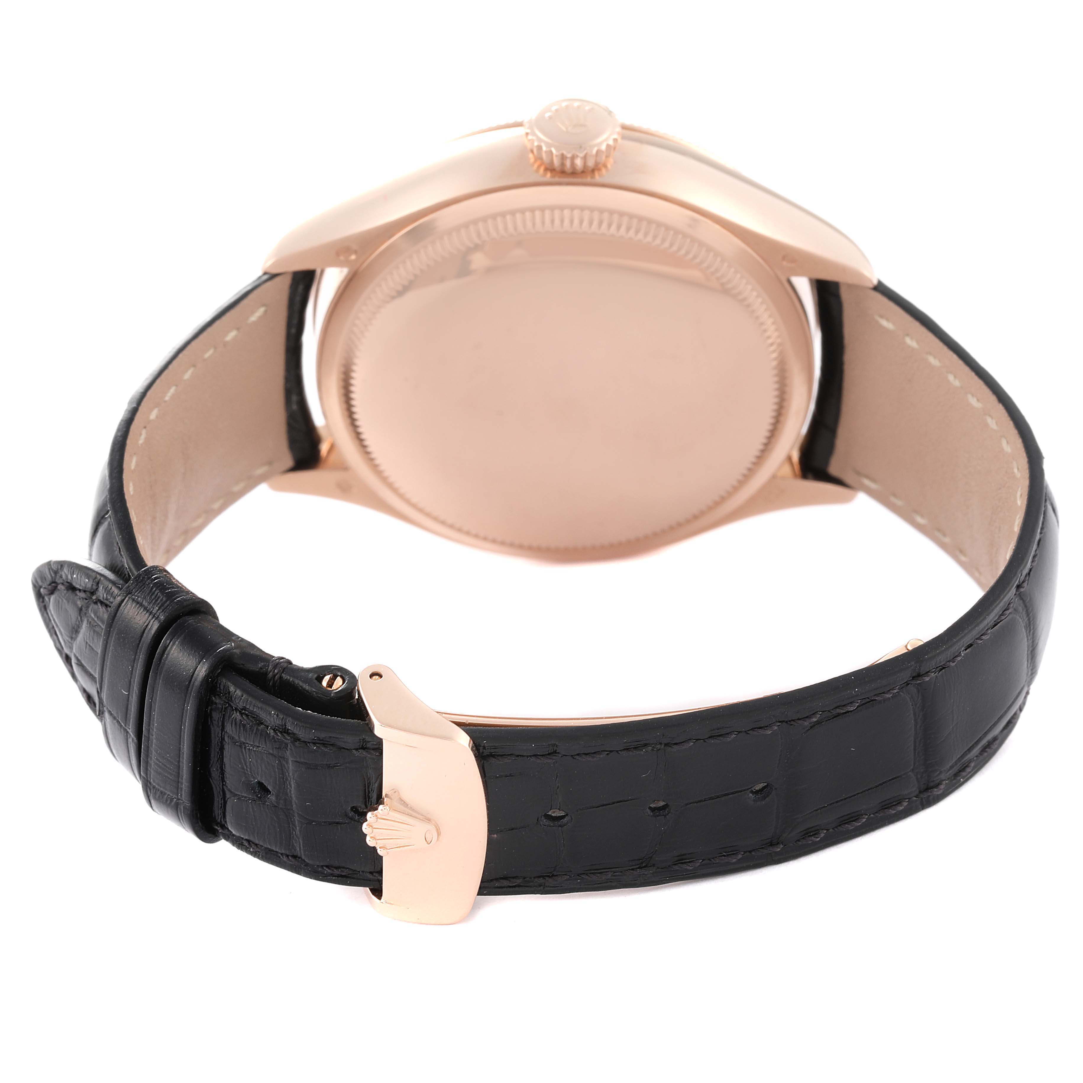 The image shows the back view of a Rolex Cellini 50535 Men
s Rose Gold White Dial 50535 Men
s Rose Gold White Dial watch, highlighting its case, crown, and black leather strap.