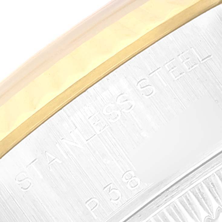 This is a close-up of the Rolex Datejust 79173 Women's Steel and Gold (two tone) White Dial 79173 Women's Steel and Gold (two tone) White Dial watch's bezel and case, showcasing the stainless steel and gold detailing.