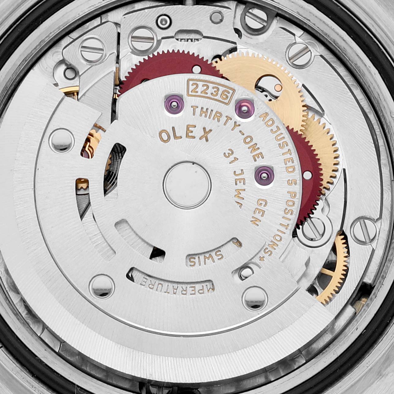 This is a close-up shot of the inner mechanism of a Rolex Datejust 279173 Women's Steel and Gold (two tone) Champagne Dial 279173 Women's Steel and Gold (two tone) Champagne Dial watch, showing gears and jewels.