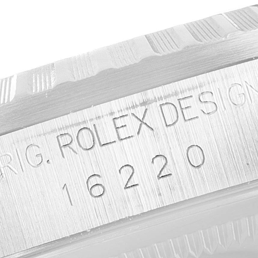 The image shows an engraved case reference number "16220" on the side of a Rolex Datejust 16220 Men's Stainless Steel Pink Dial 16220 Men's Stainless Steel Pink Dial watch bezel.