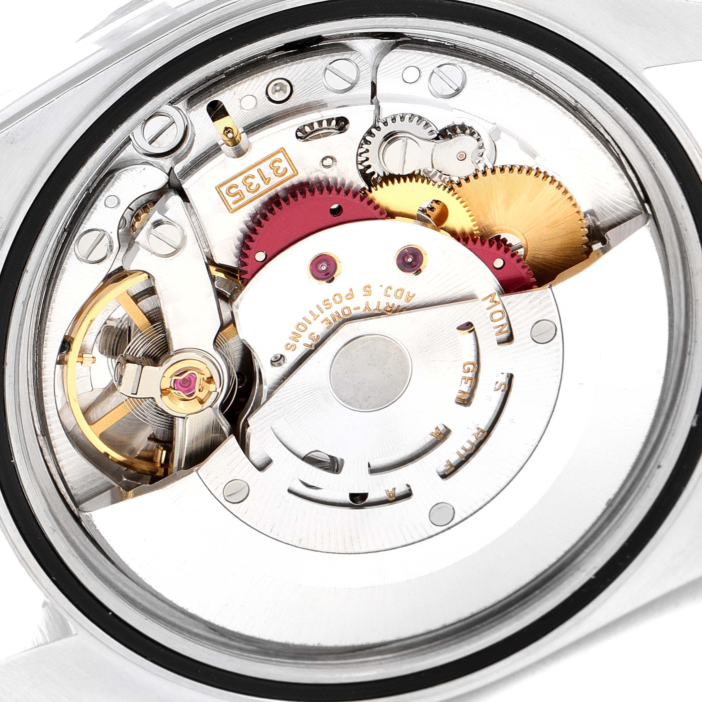 The image shows a close-up of the Rolex Datejust 16220 Men's Stainless Steel Pink Dial 16220 Men's Stainless Steel Pink Dial's internal mechanism, highlighting gears and components from the back.