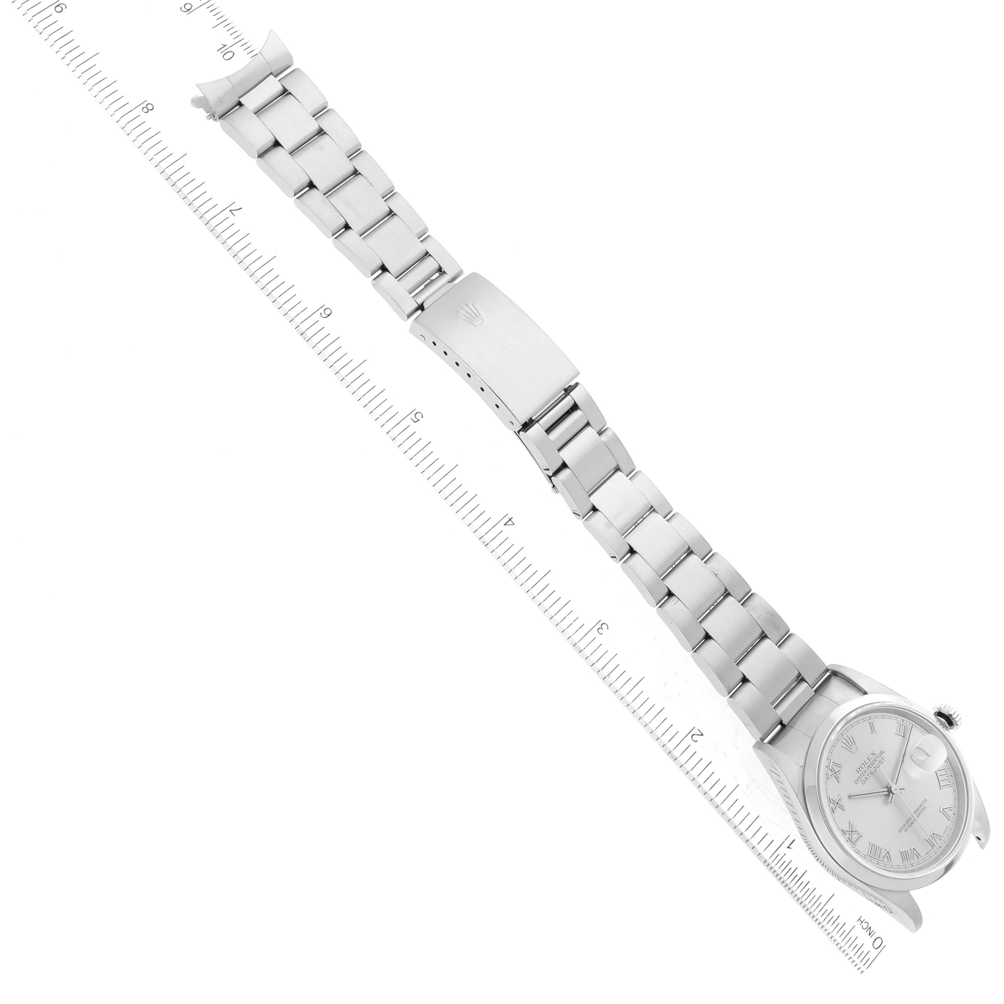 This image shows a Rolex Datejust 16200 Men's Stainless Steel Silver Dial 16200 Men's Stainless Steel Silver Dial watch at an angle displaying the full bracelet and partial watch face, alongside a ruler for scale.