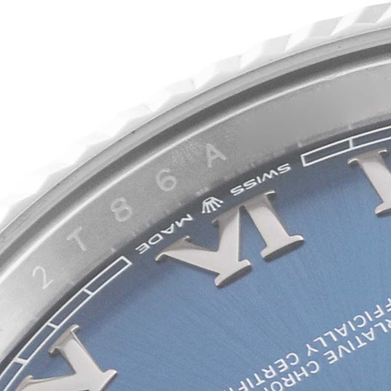 This is a close-up image of the dial and bezel of the Rolex Datejust 41 126334 Men's Stainless Steel Blue Dial 126334 Men's Stainless Steel Blue Dial watch, showing Roman numerals and part of the "Swiss Made" label.