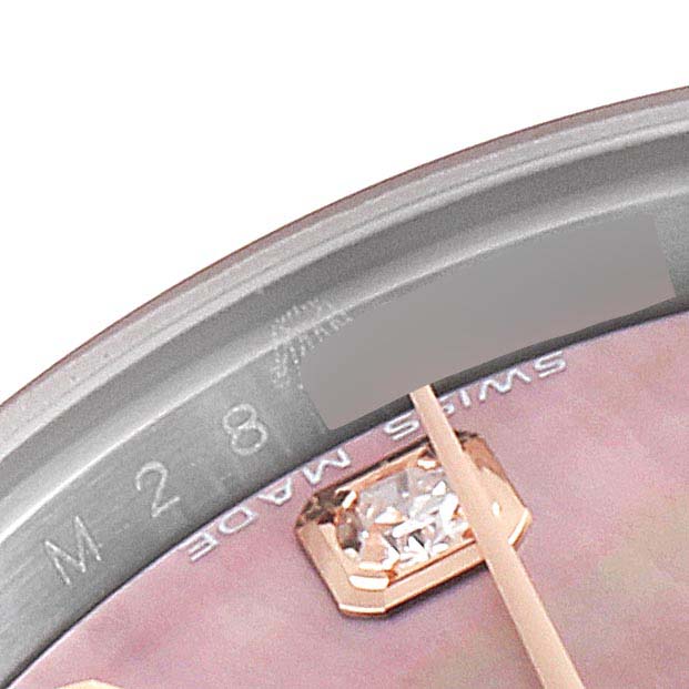 This image shows a close-up of the dial and the edge of the bezel of a Rolex Datejust 179171 Women's Steel and Gold (two tone) Mother of Pearl Dial 179171 Women's Steel and Gold (two tone) Mother of Pearl Dial watch, featuring a diamond hour marker.