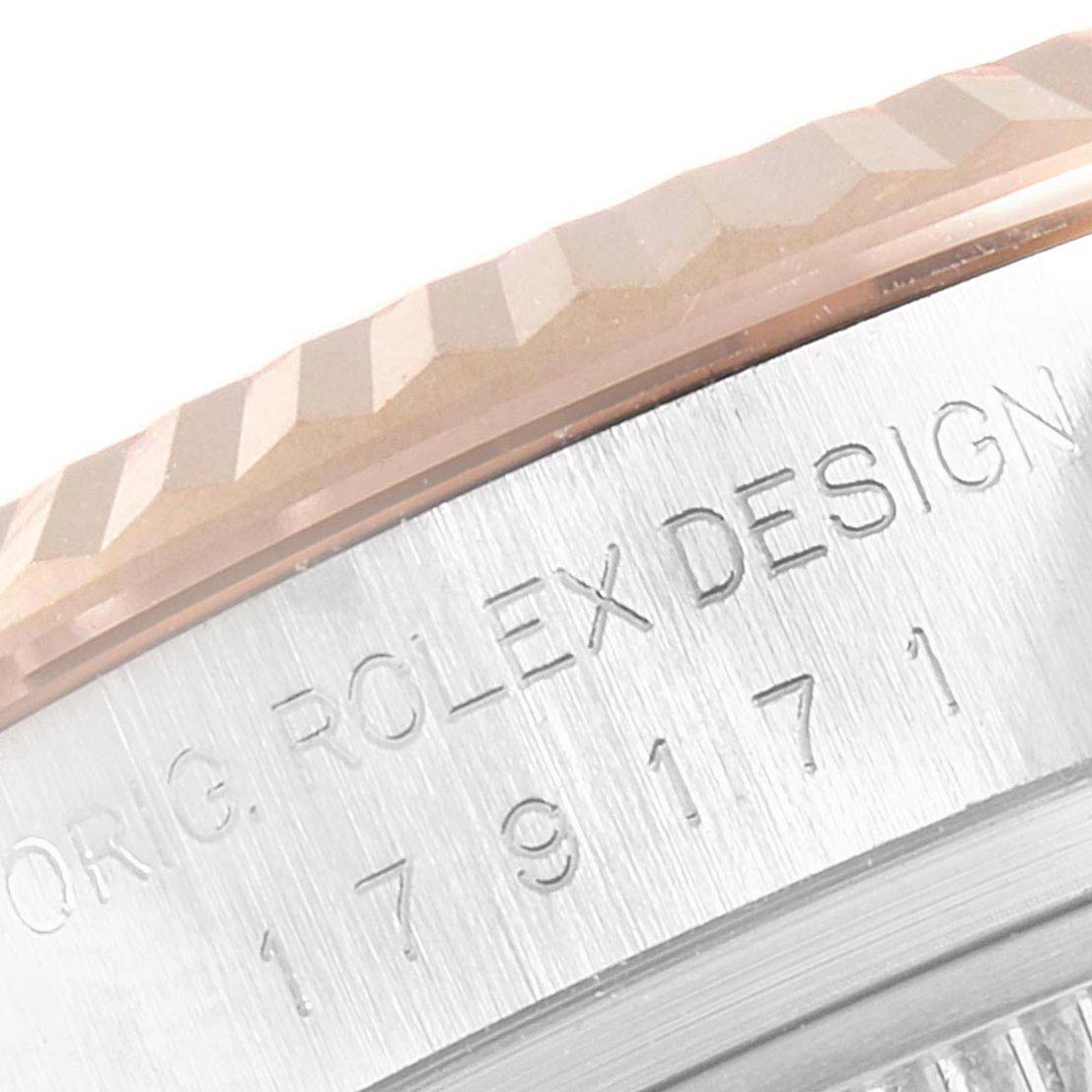 This image shows a close-up of the case side and fluted bezel of a Rolex Datejust 179171 Women's Steel and Gold (two tone) Mother of Pearl Dial 179171 Women's Steel and Gold (two tone) Mother of Pearl Dial watch.