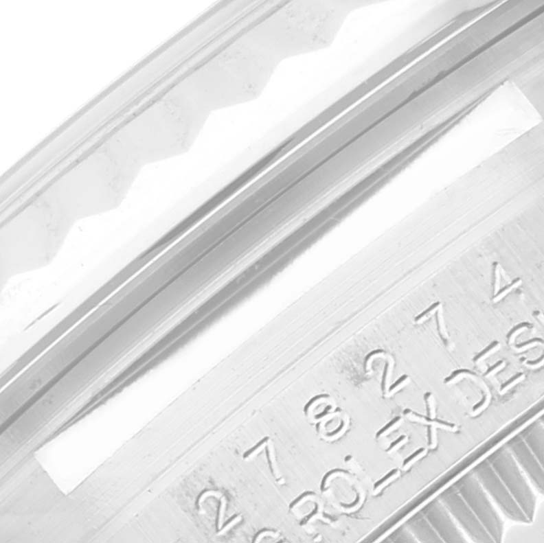 This image shows a close-up of the bezel and part of the engraved casing for a Rolex Mid-Size 278274 Women's Stainless Steel Purple Dial 278274 Women's Stainless Steel Purple Dial model watch.