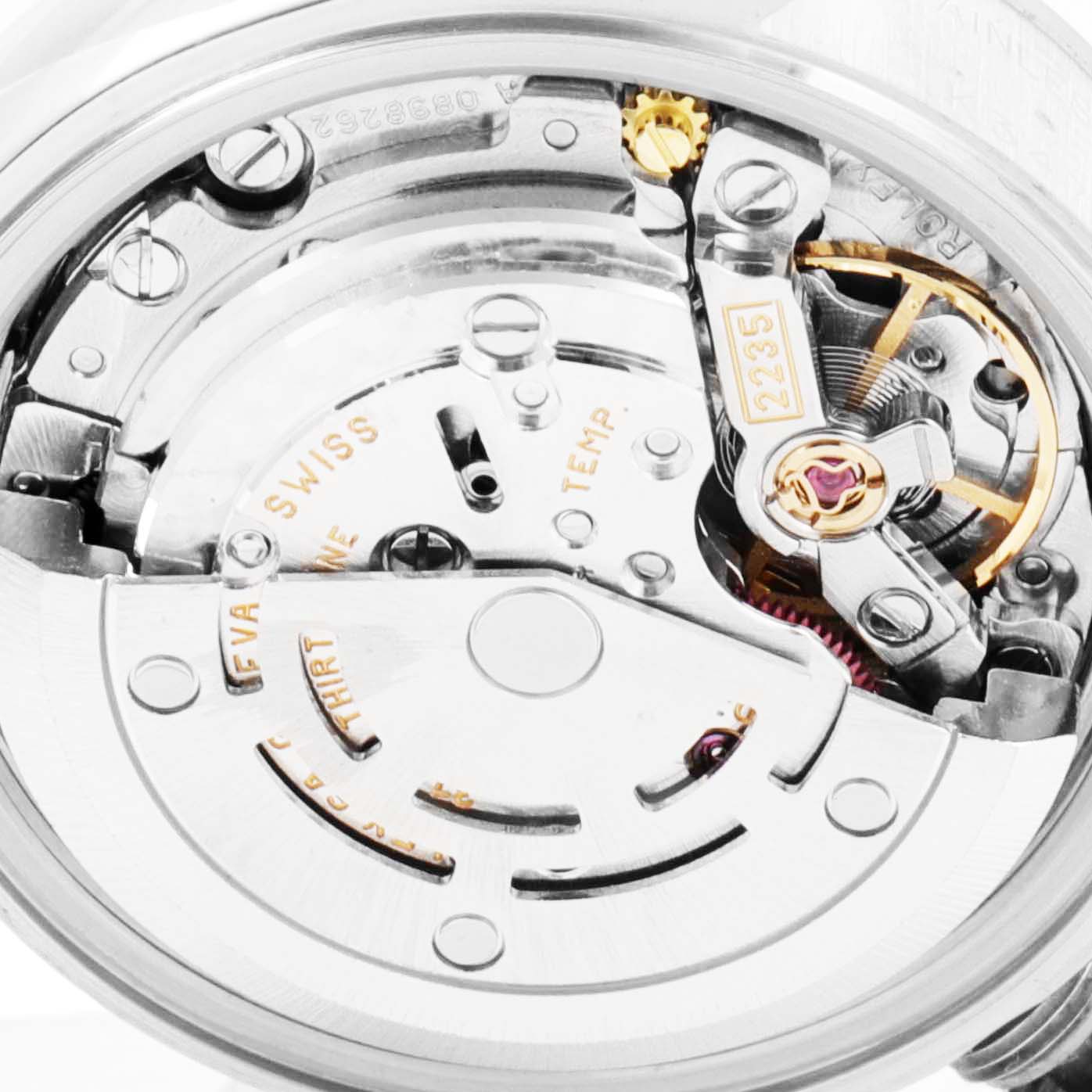 The image shows a close-up of the movement inside a Rolex Date 79190 Women's Stainless Steel Silver Dial 79190 Women's Stainless Steel Silver Dial model watch, highlighting its intricate mechanics and components.