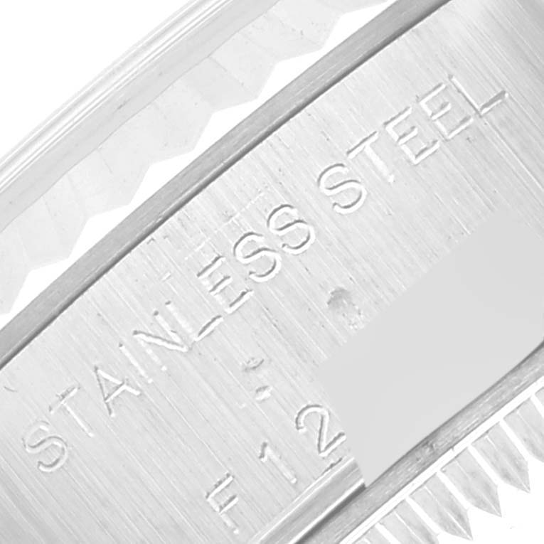 The image shows a close-up of the casing with "STAINLESS STEEL" engraved on the Rolex Datejust 79174 Women's Stainless Steel White Dial 79174 Women's Stainless Steel White Dial model.