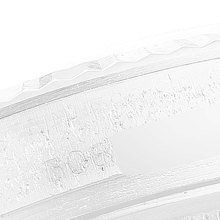 This image shows a close-up of the engraved bezel of the Rolex Vintage Collection 1601 Men's Stainless Steel Silver Dial 1601 Men's Stainless Steel Silver Dial watch.