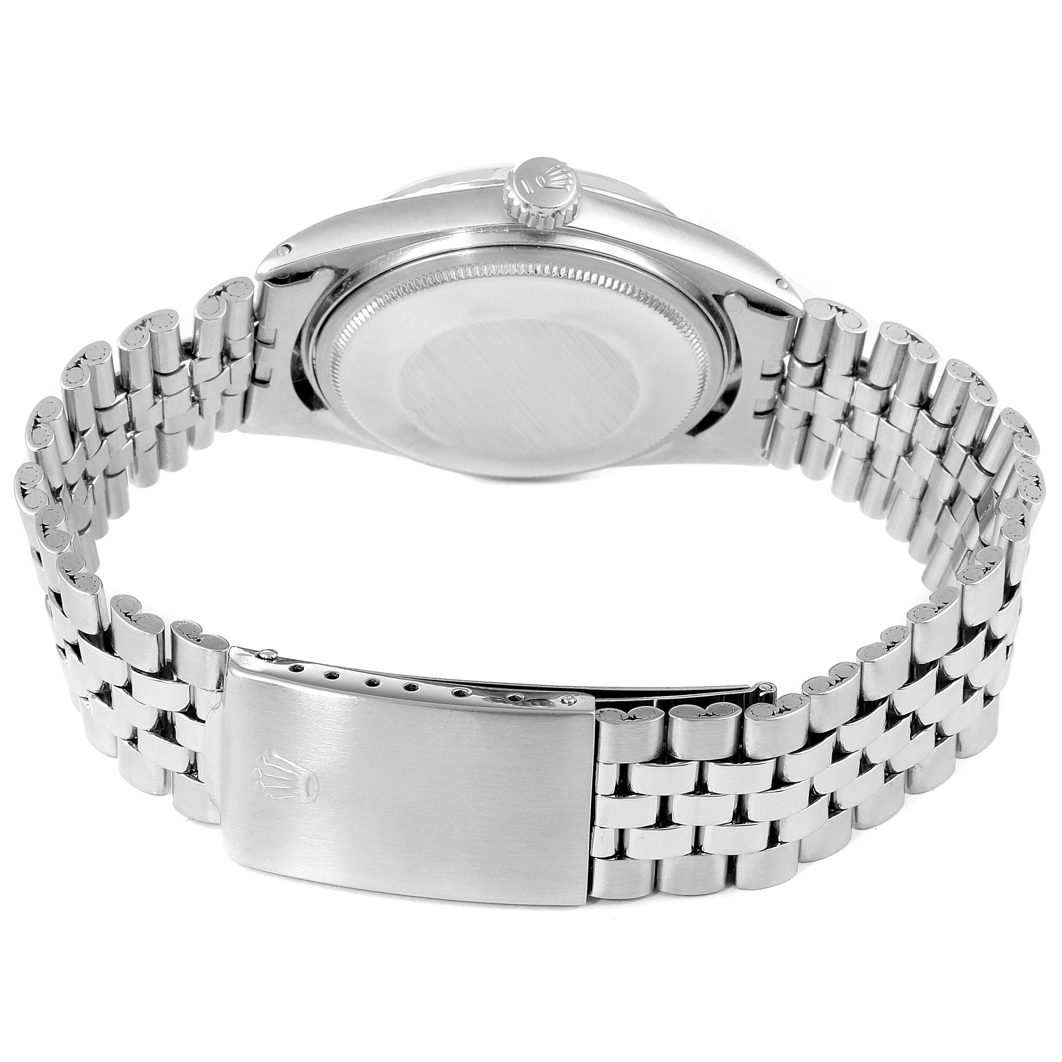 The image shows the back view of a Rolex Vintage Collection 1601 Men's Stainless Steel Silver Dial 1601 Men's Stainless Steel Silver Dial watch, highlighting the case back, crown, and stainless steel bracelet.