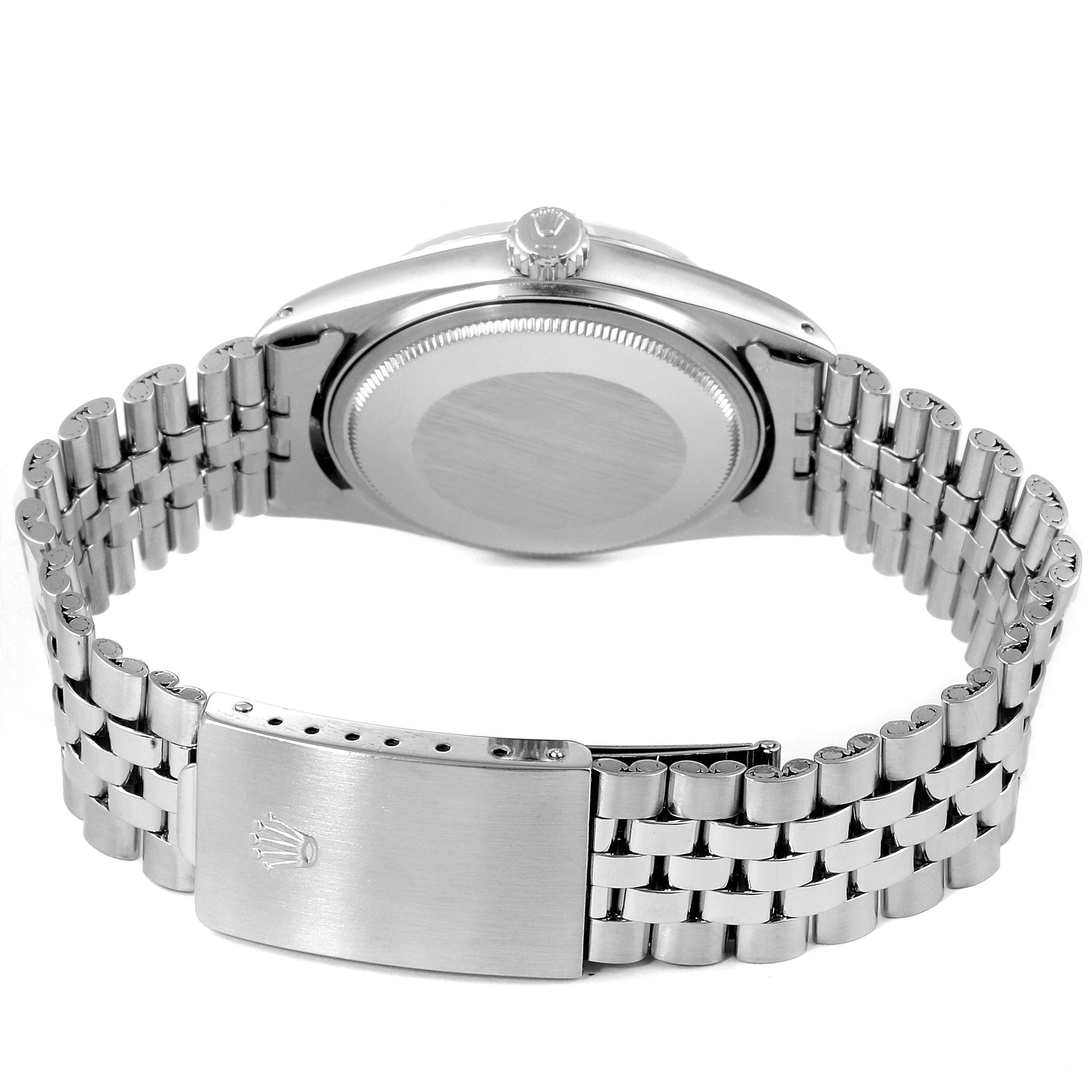 The image shows the back case, crown, and bracelet clasp of a Rolex Vintage Collection 1601 Men's Stainless Steel Silver Dial 1601 Men's Stainless Steel Silver Dial model watch.