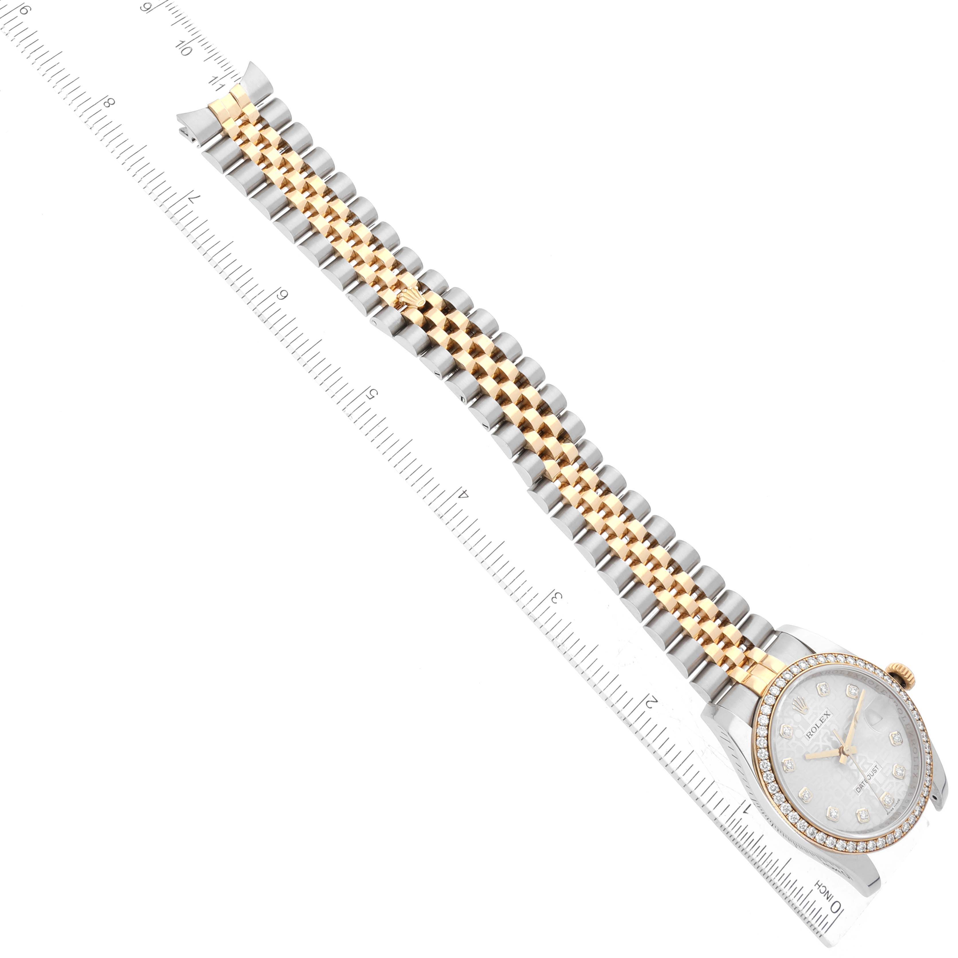 The image shows a Rolex Datejust 116243 Men's Steel and Gold (two tone) Silver Dial 116243 Men's Steel and Gold (two tone) Silver Dial watch lying flat with its bracelet fully extended alongside a ruler for measurement.