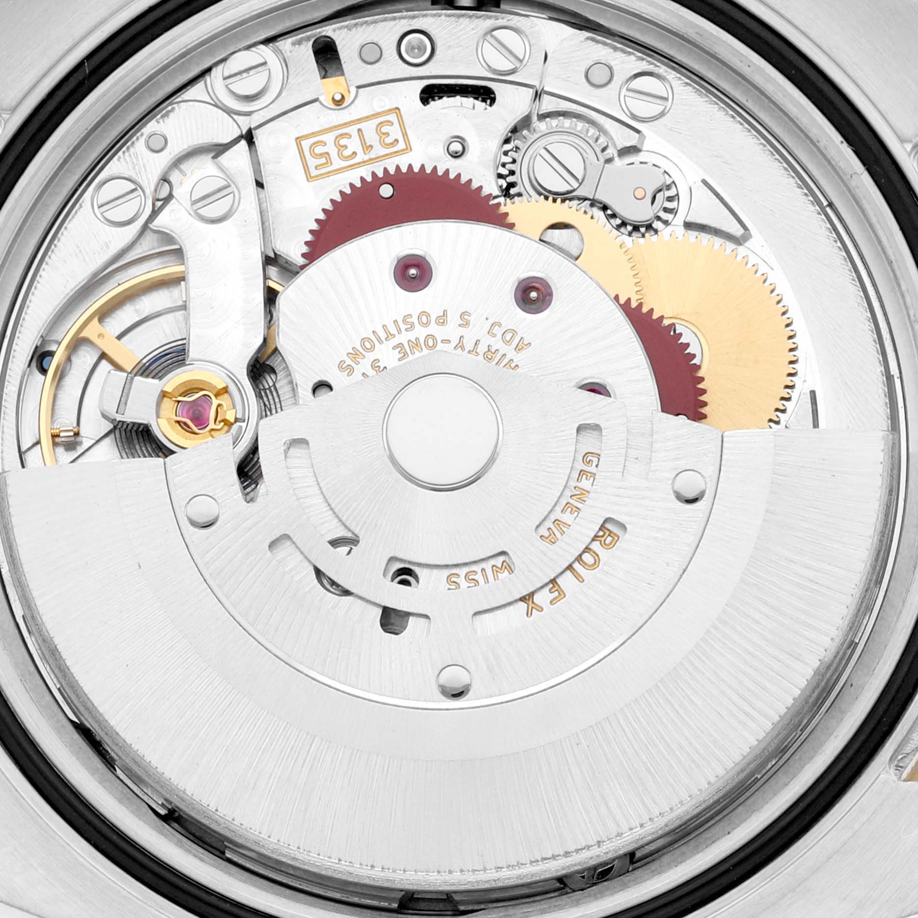 The image shows the intricate internal mechanism of a Rolex Datejust 116243 Men's Steel and Gold (two tone) Silver Dial 116243 Men's Steel and Gold (two tone) Silver Dial model from a top-down angle, highlighting gears and components.