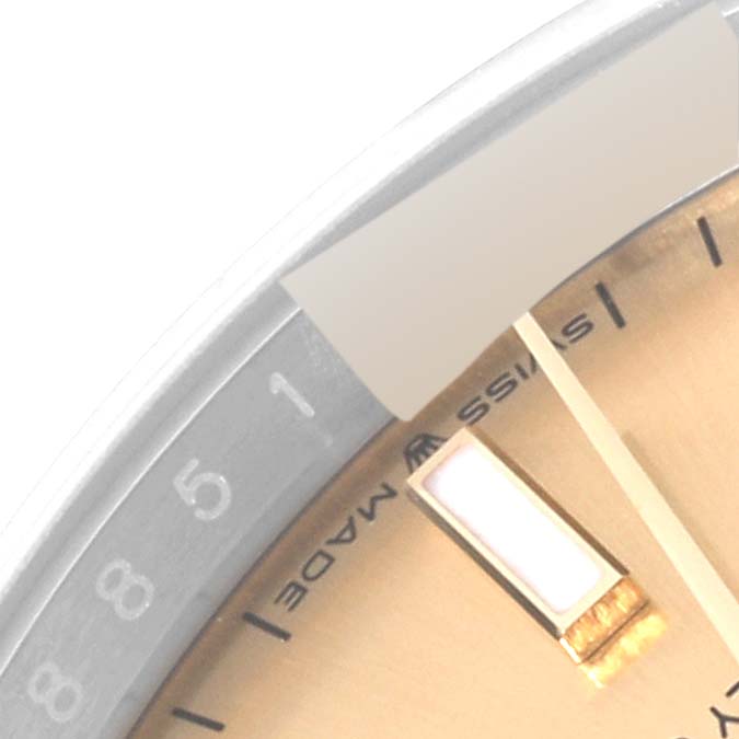 This is a close-up angle of a Rolex Datejust 126233 Men's Steel and Gold (two tone) Champagne Dial 126233 Men's Steel and Gold (two tone) Champagne Dial watch, focusing on the edge of the dial and part of the hour marker.