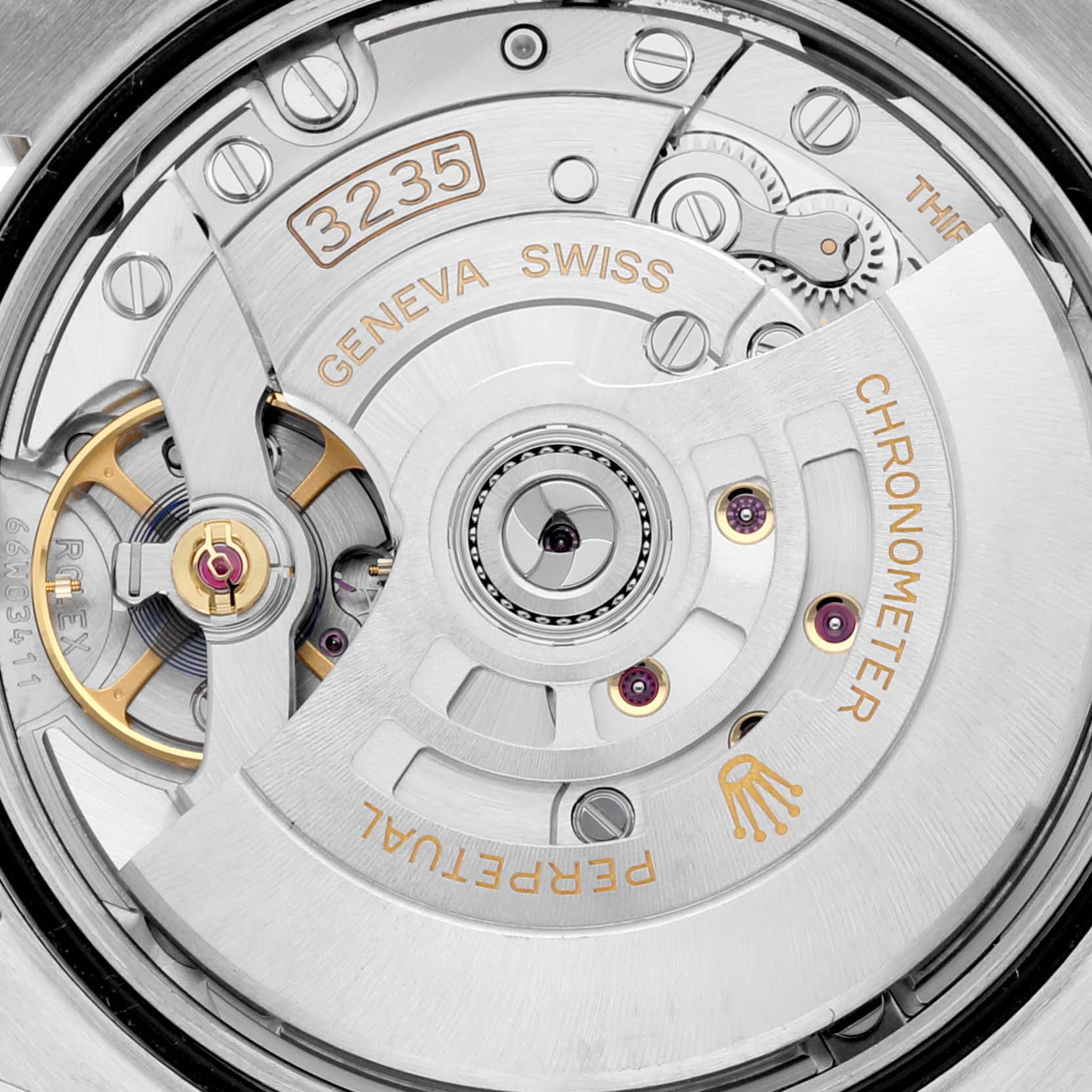 The image shows a close-up view of the movement mechanism of a Rolex Datejust 126233 Men's Steel and Gold (two tone) Champagne Dial 126233 Men's Steel and Gold (two tone) Champagne Dial, highlighting the intricate internal components.