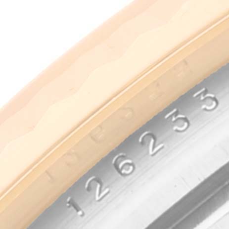 This image shows a close-up of the serial number engraving on the side of the bezel of the Rolex Datejust 126233 Men's Steel and Gold (two tone) Champagne Dial 126233 Men's Steel and Gold (two tone) Champagne Dial model.