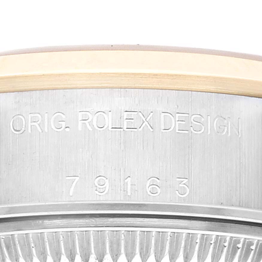 This image shows the side of a Rolex Datejust 79163 Women's Steel and Gold (two tone) Champagne Dial 79163 Women's Steel and Gold (two tone) Champagne Dial watch, detailing the "Orig. Rolex Design" and model number 79163.