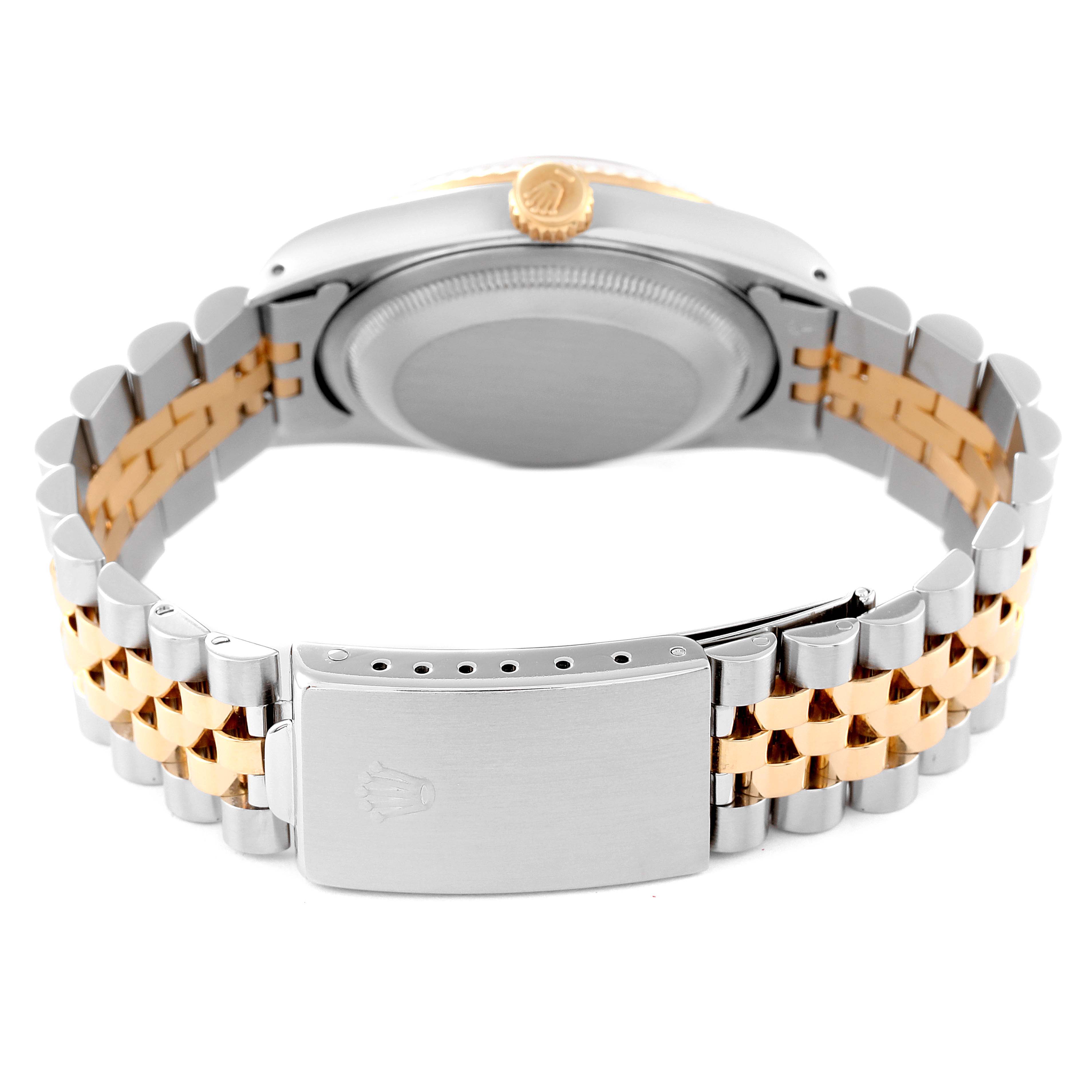 This image shows the clasp and backside of the bracelet of a Rolex Datejust 16233 Men's Steel and Gold (two tone) Champagne Dial 16233 Men's Steel and Gold (two tone) Champagne Dial watch.