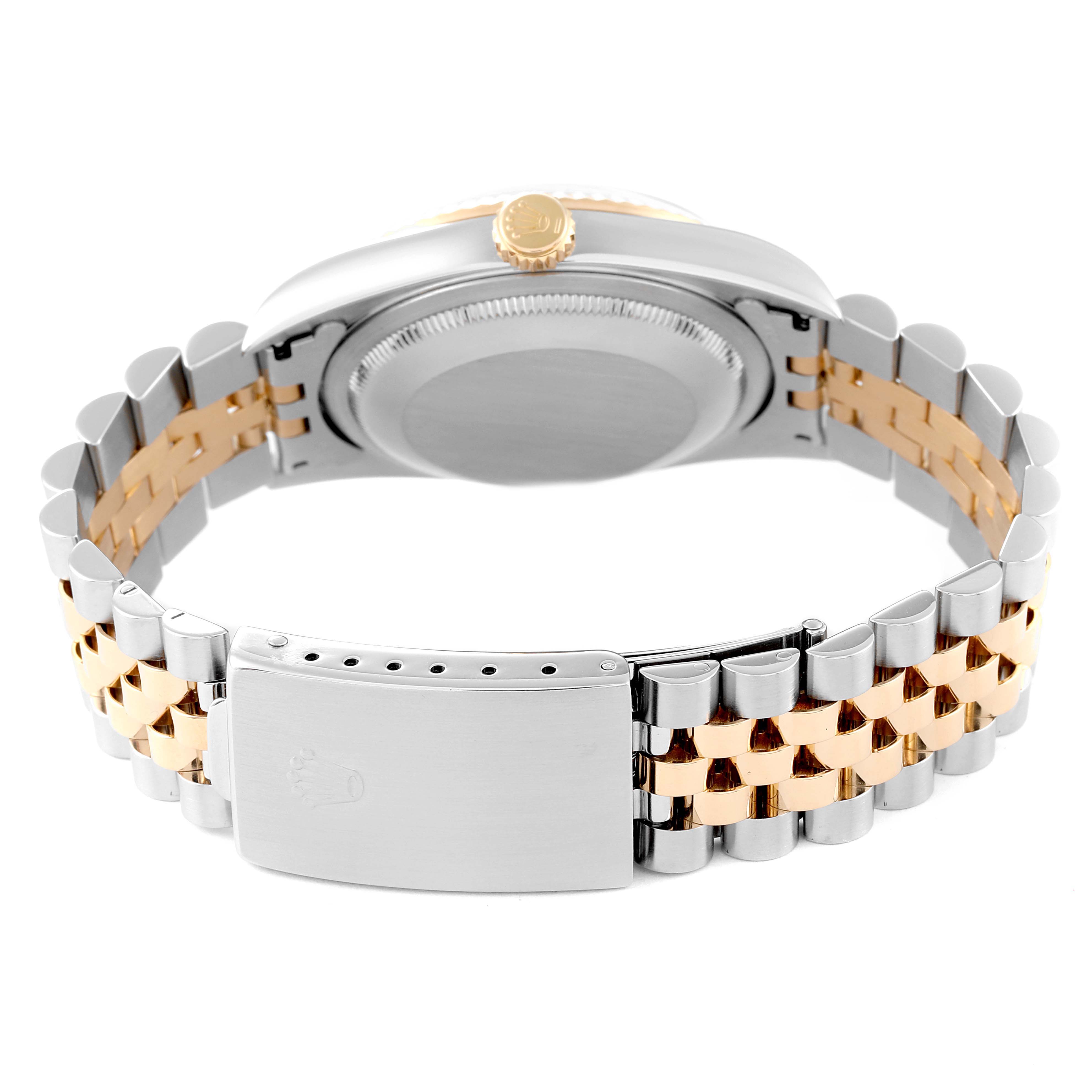 The image shows the back view of a Rolex Datejust 16233 Men's Steel and Gold (two tone) White Dial 16233 Men's Steel and Gold (two tone) White Dial watch, focusing on the case back, crown, and two-tone bracelet with a clasp.
