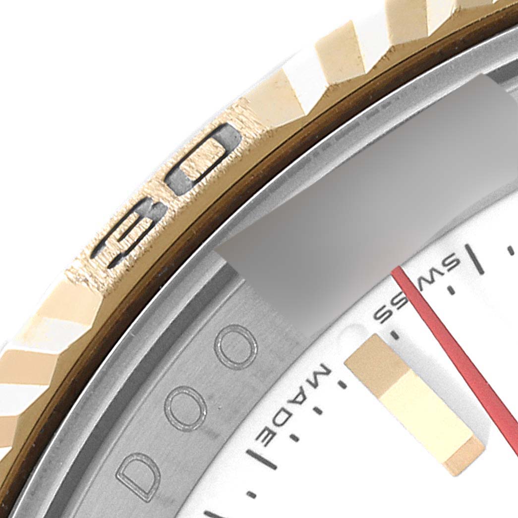 The image shows a close-up of the bezel and a portion of the dial of a Rolex Turn-o-Graph 116263 Men's Steel and Gold (two tone) White Dial 116263 Men's Steel and Gold (two tone) White Dial watch.