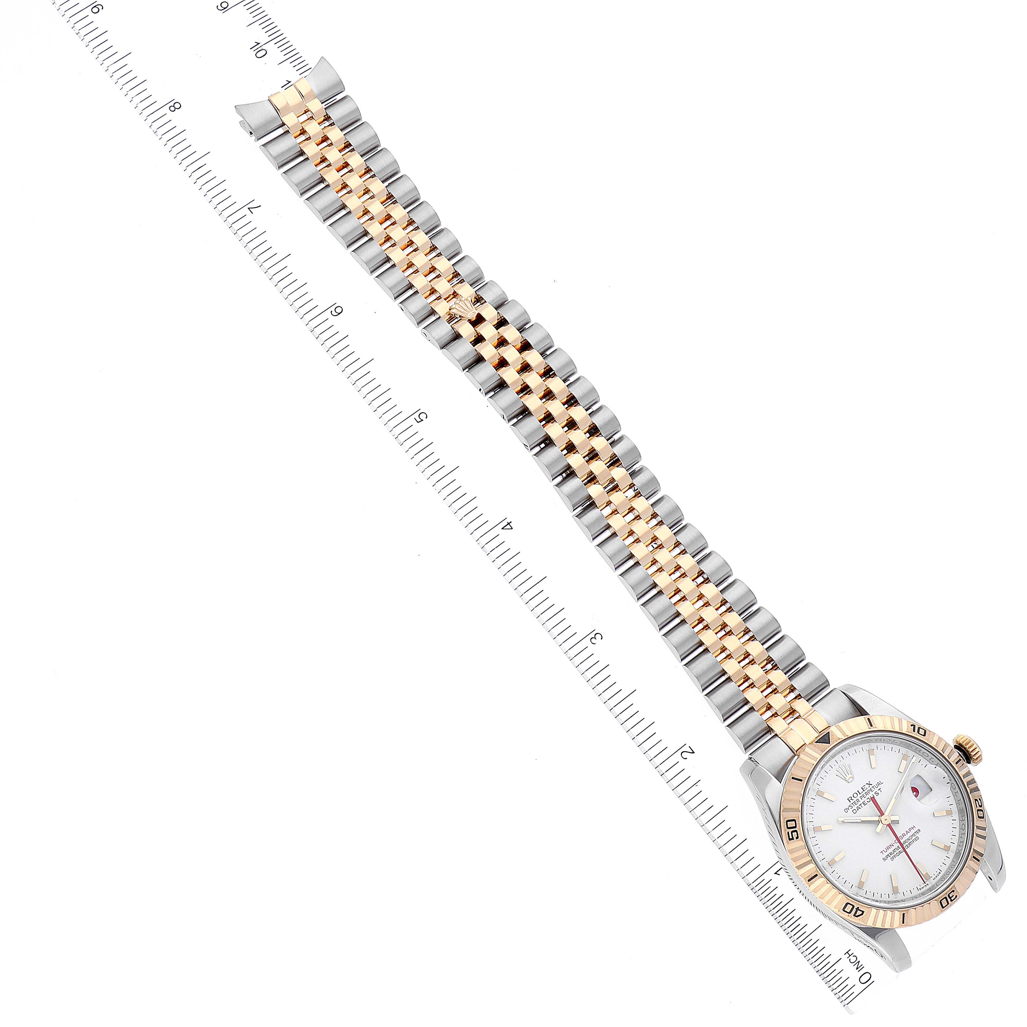 The image shows a Rolex Turn-o-Graph 116263 Men's Steel and Gold (two tone) White Dial 116263 Men's Steel and Gold (two tone) White Dial watch laid flat with its face, bezel, and two-tone bracelet visible, and a ruler for scale.