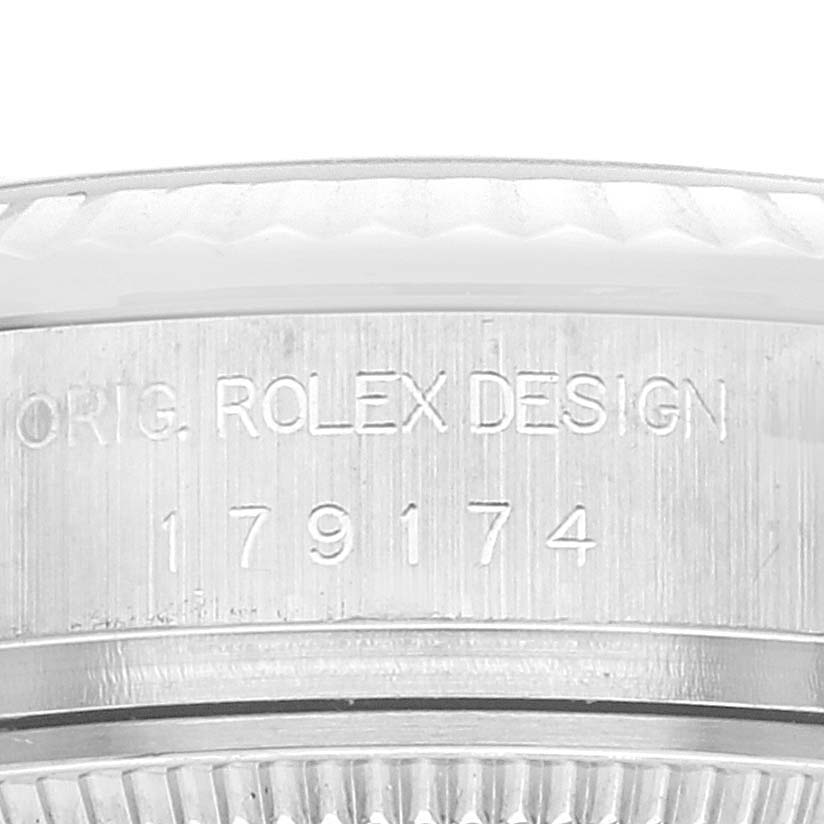 This is a close-up view of the bezel and the case side of a Rolex Datejust 179174 Women's Stainless Steel Silver Dial 179174 Women's Stainless Steel Silver Dial, showing the model number and "ORIG. ROLEX DESIGN" engraving.
