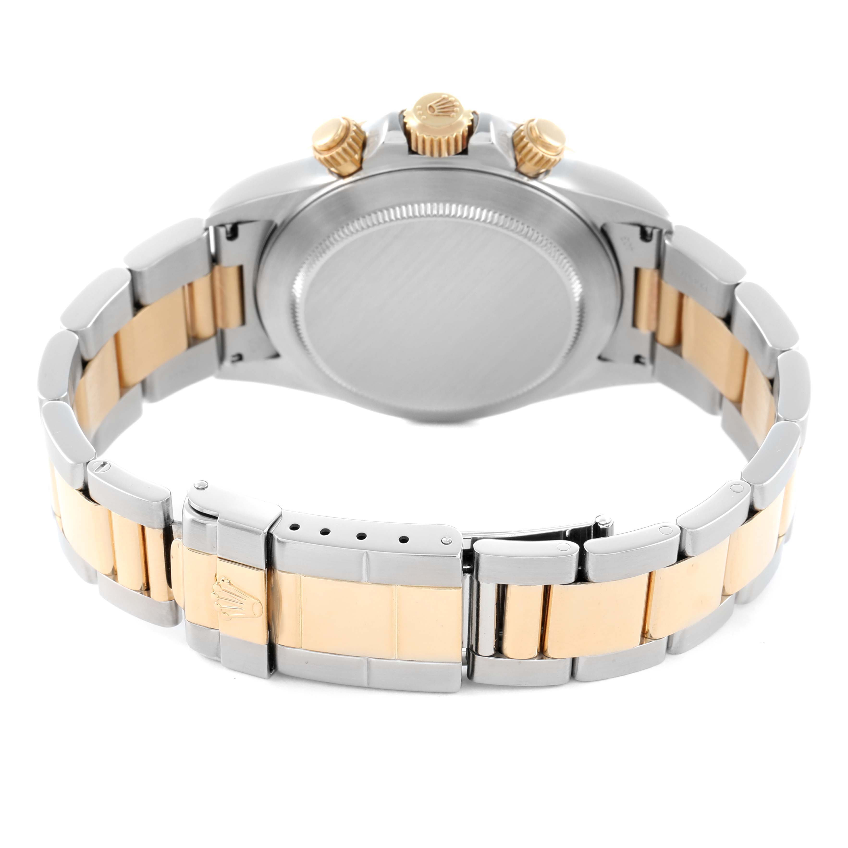 The image shows the back case and bracelet of a Rolex Daytona 16523 Men's Steel and Gold (two tone) White Dial, highlighting the clasp, crown, and pushers from the rear angle.